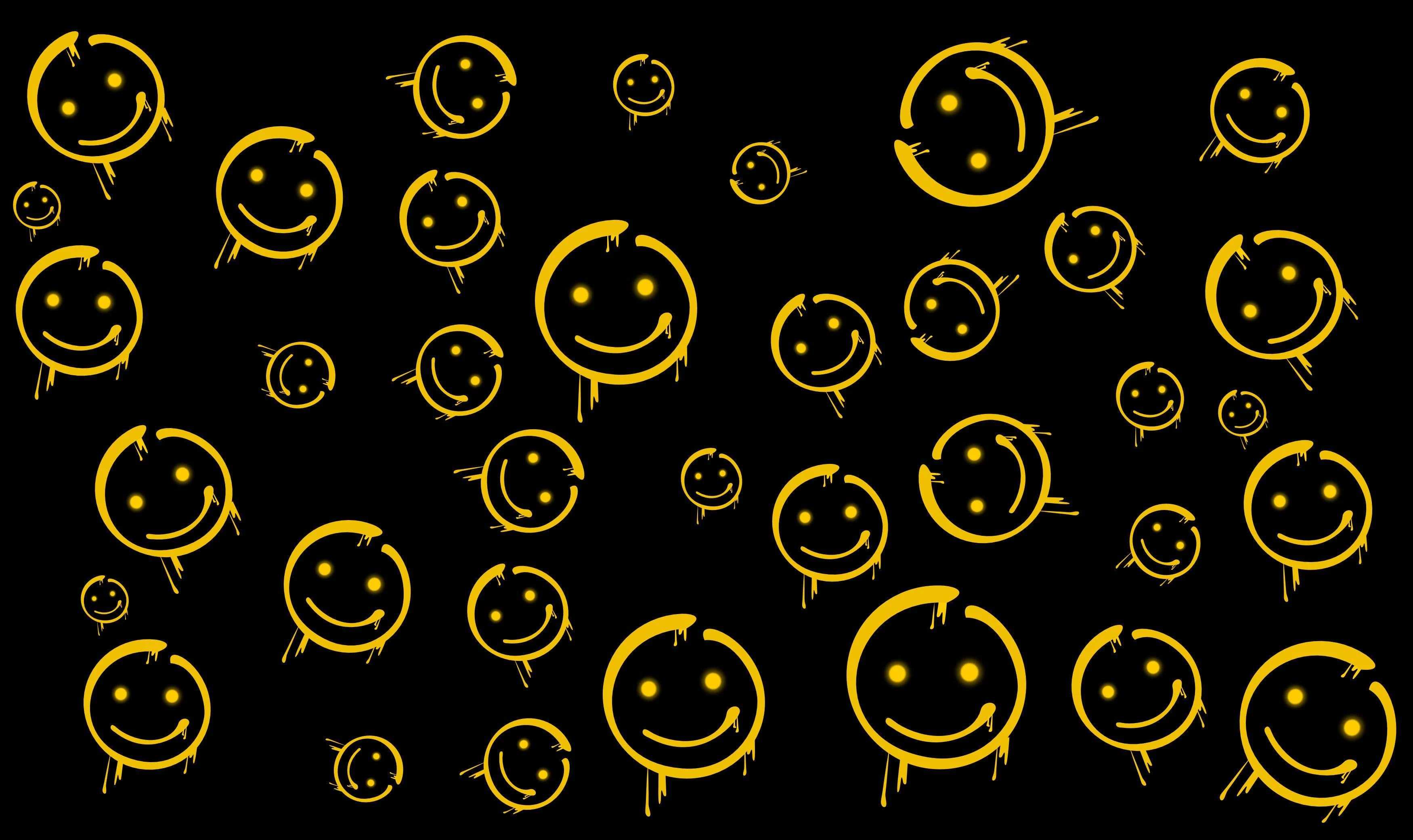 A yellow smiley face on black background - Smiley