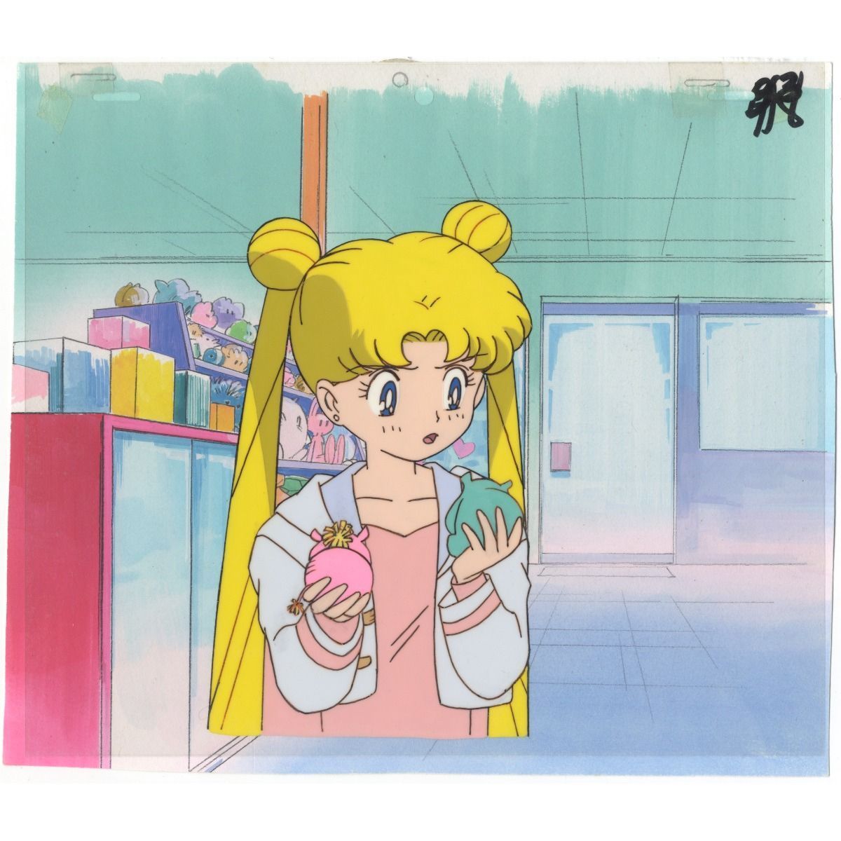 Usagi holding two transformation items, one pink and one green, in front of a store. - Sailor Moon