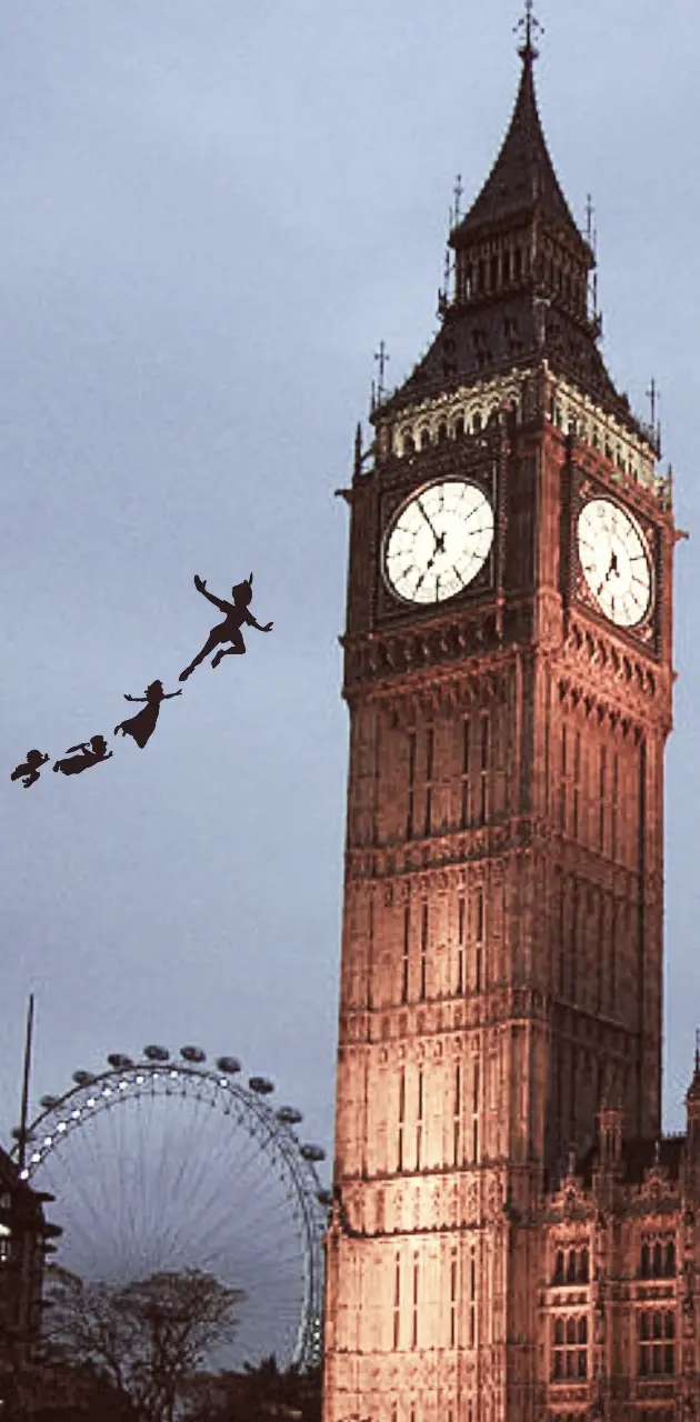A large clock tower with people flying around it - Peter Pan