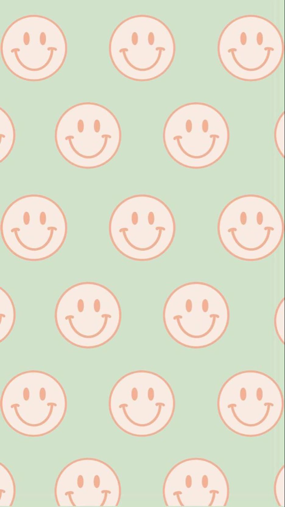 A pattern of smiling faces on green background - Smiley