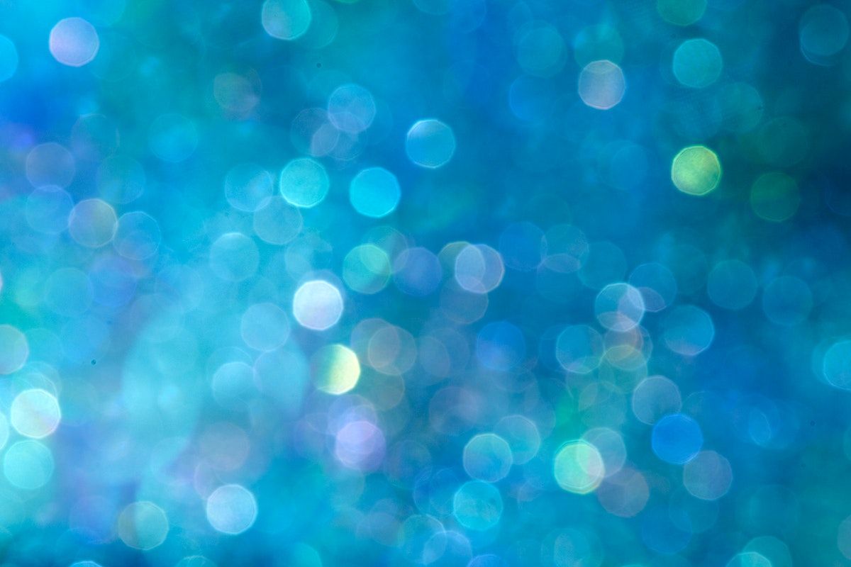 A close up of a blue background with bokeh lights - Cyan