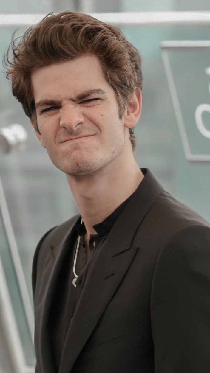 Andrew Garfield smiling and making a face for the camera - Andrew Garfield