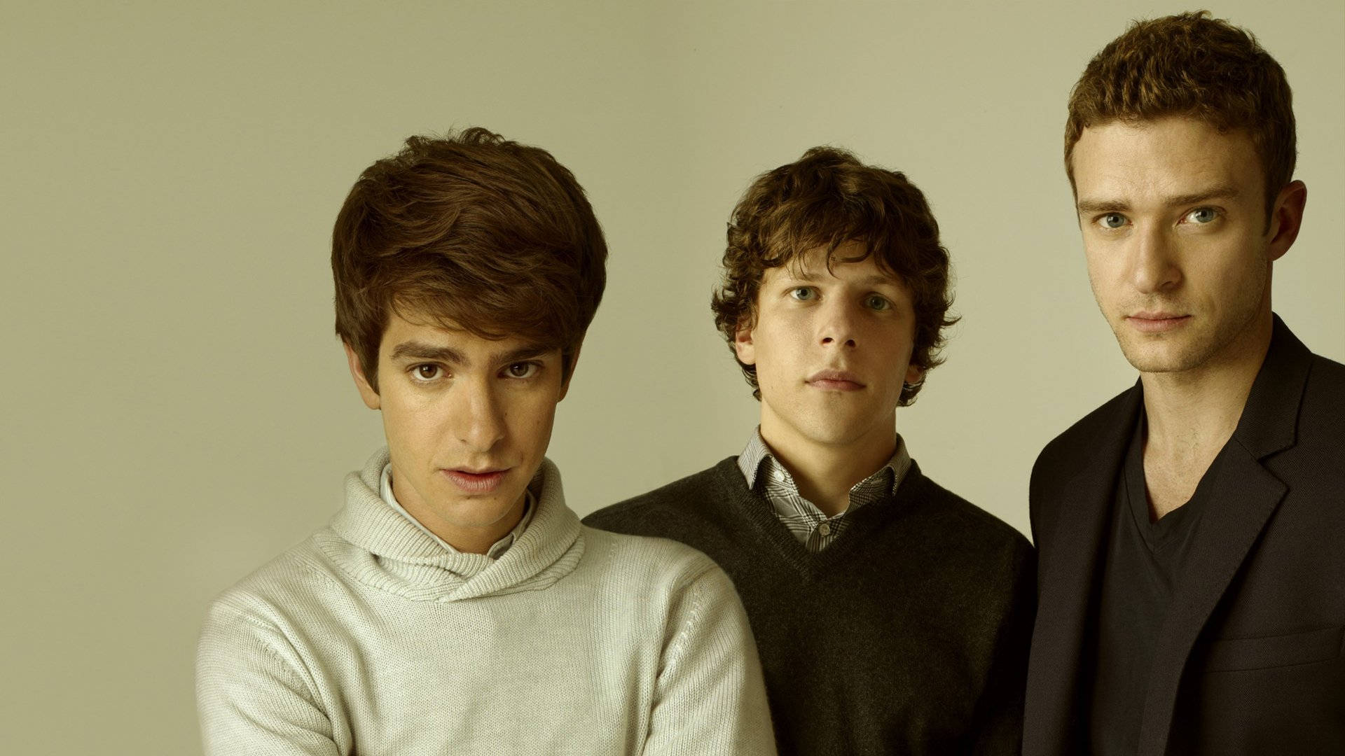 Three young men standing next to each other. - Andrew Garfield