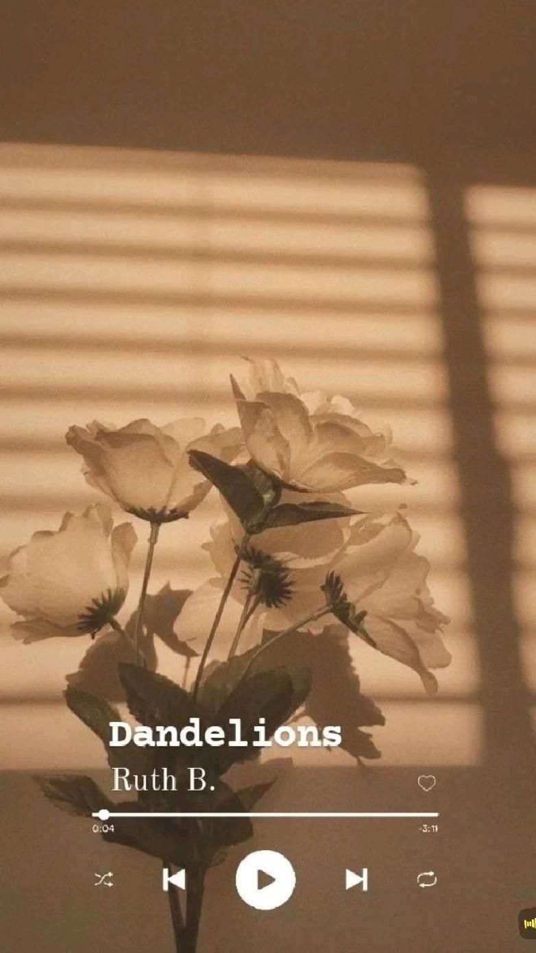 Dandelions by Ruth B. is playing on a phone screen with a picture of flowers in the background. - Dandelions