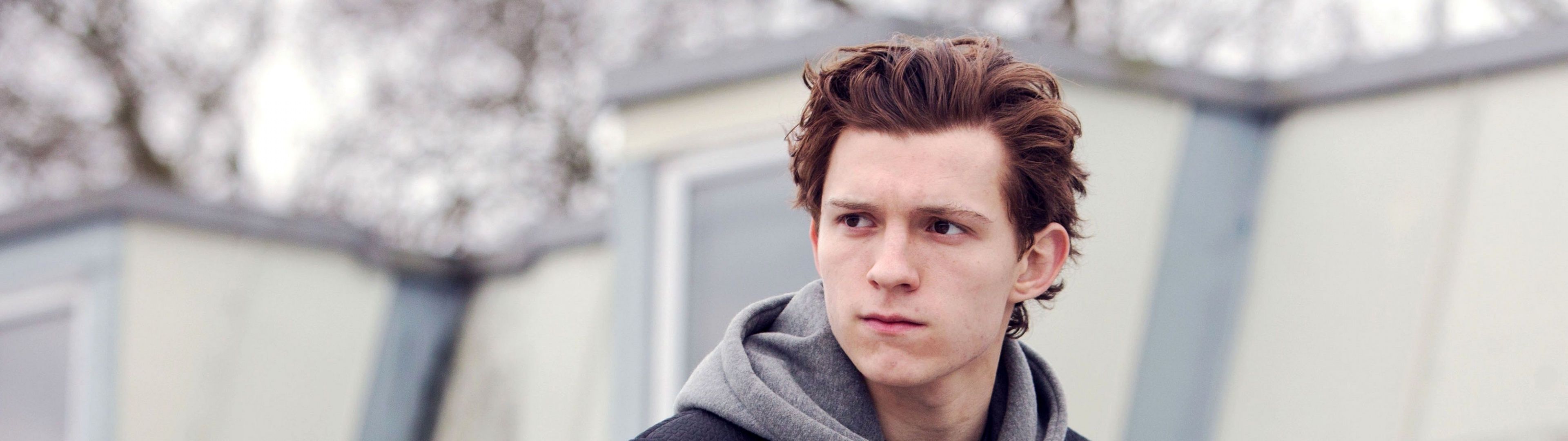 Tom Holland, the actor who plays Spiderman, looks into the camera. - Tom Holland