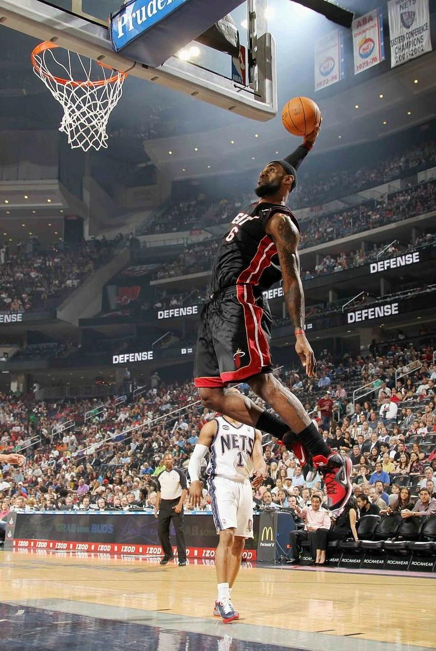 LeBron James of the Miami Heat goes up for a dunk against the New Jersey Nets. - Lebron James