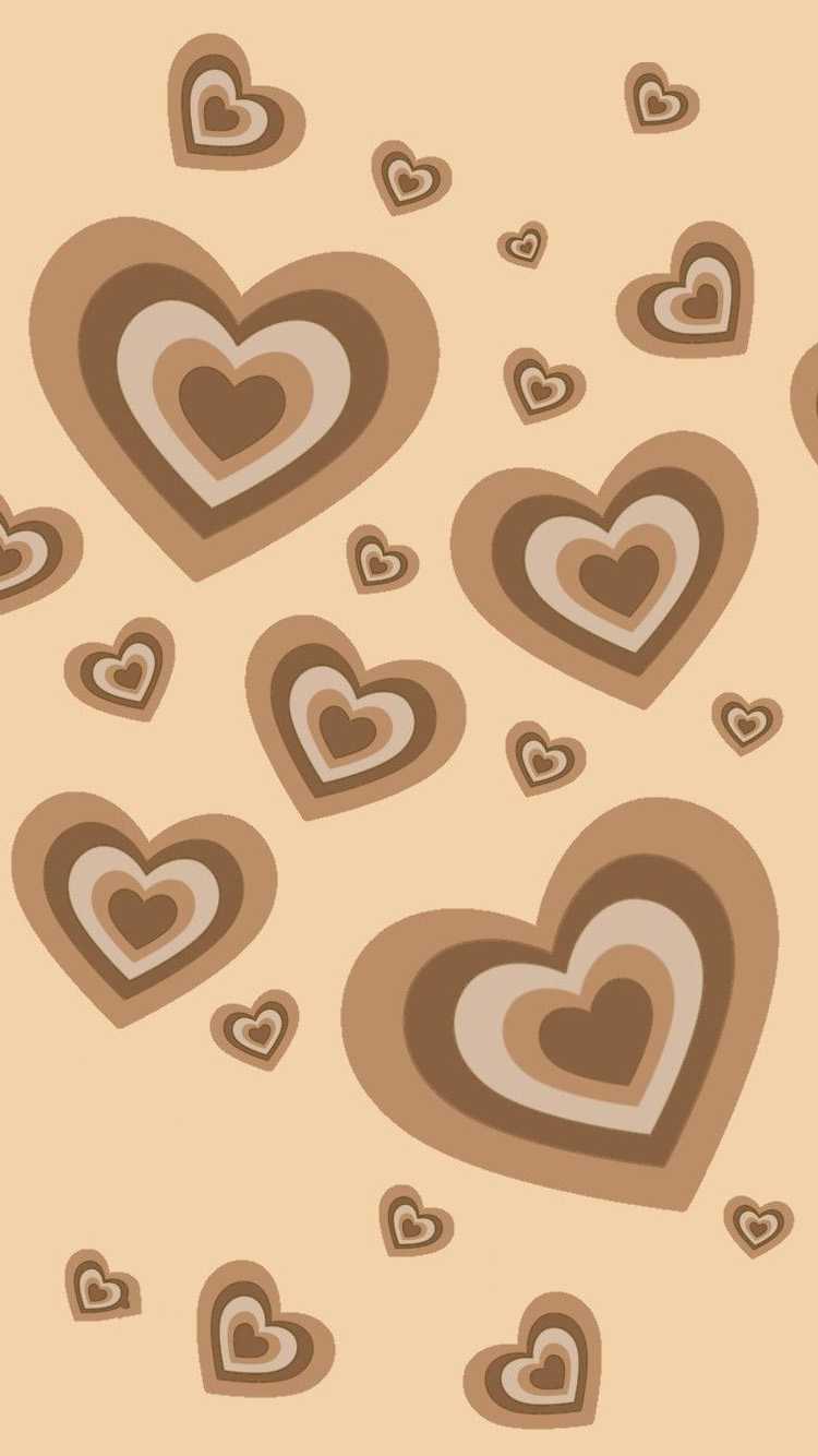 A pattern of brown hearts on beige background - Heart