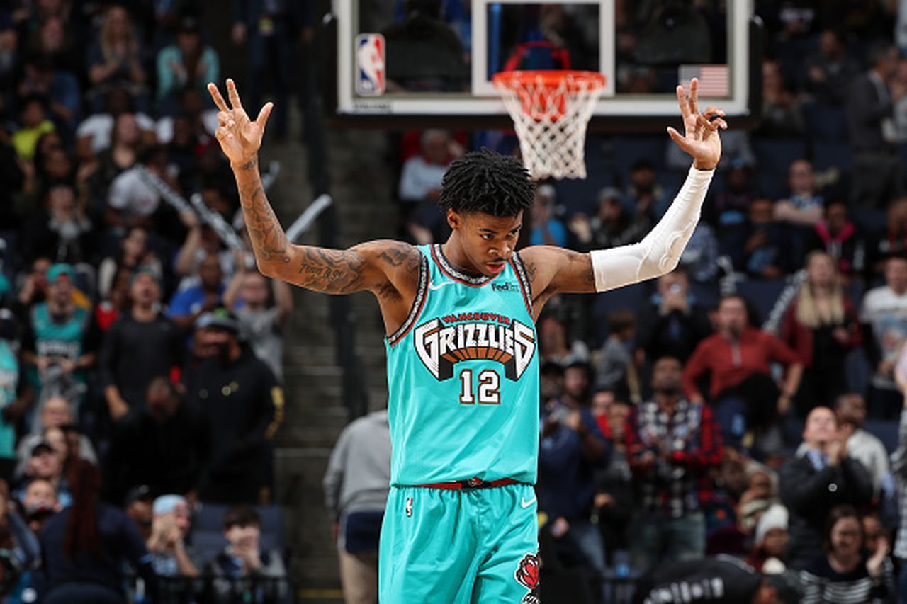 Ja Morant of the Memphis Grizzlies celebrates after making a basket against the New York Knicks during the second half at FedExForum on February 27, 2020 in Memphis, Tennessee. - Ja Morant