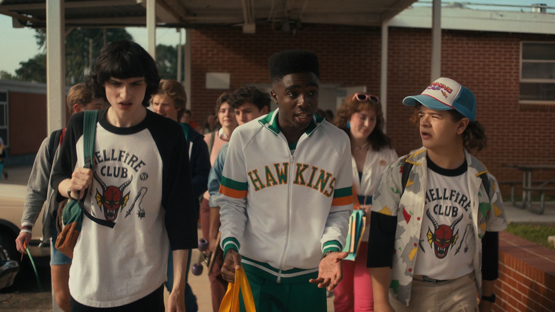 A group of high schoolers, including Steve, walk towards the camera. - Stranger Things