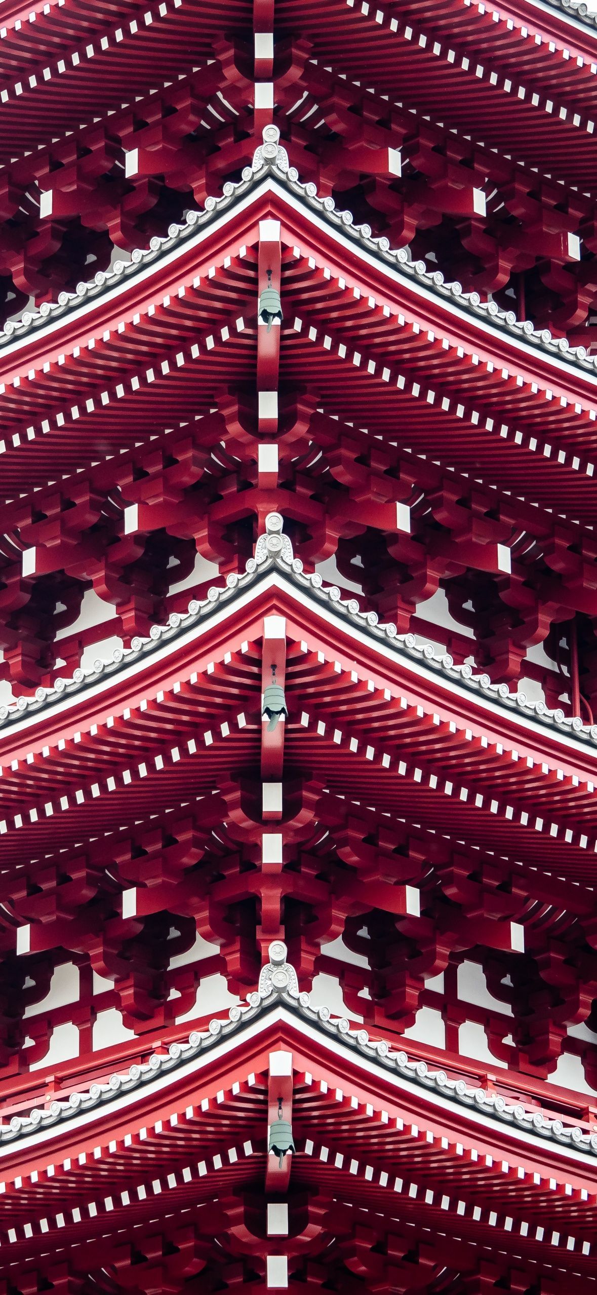 A pattern of red and white designs on a red background - Tokyo