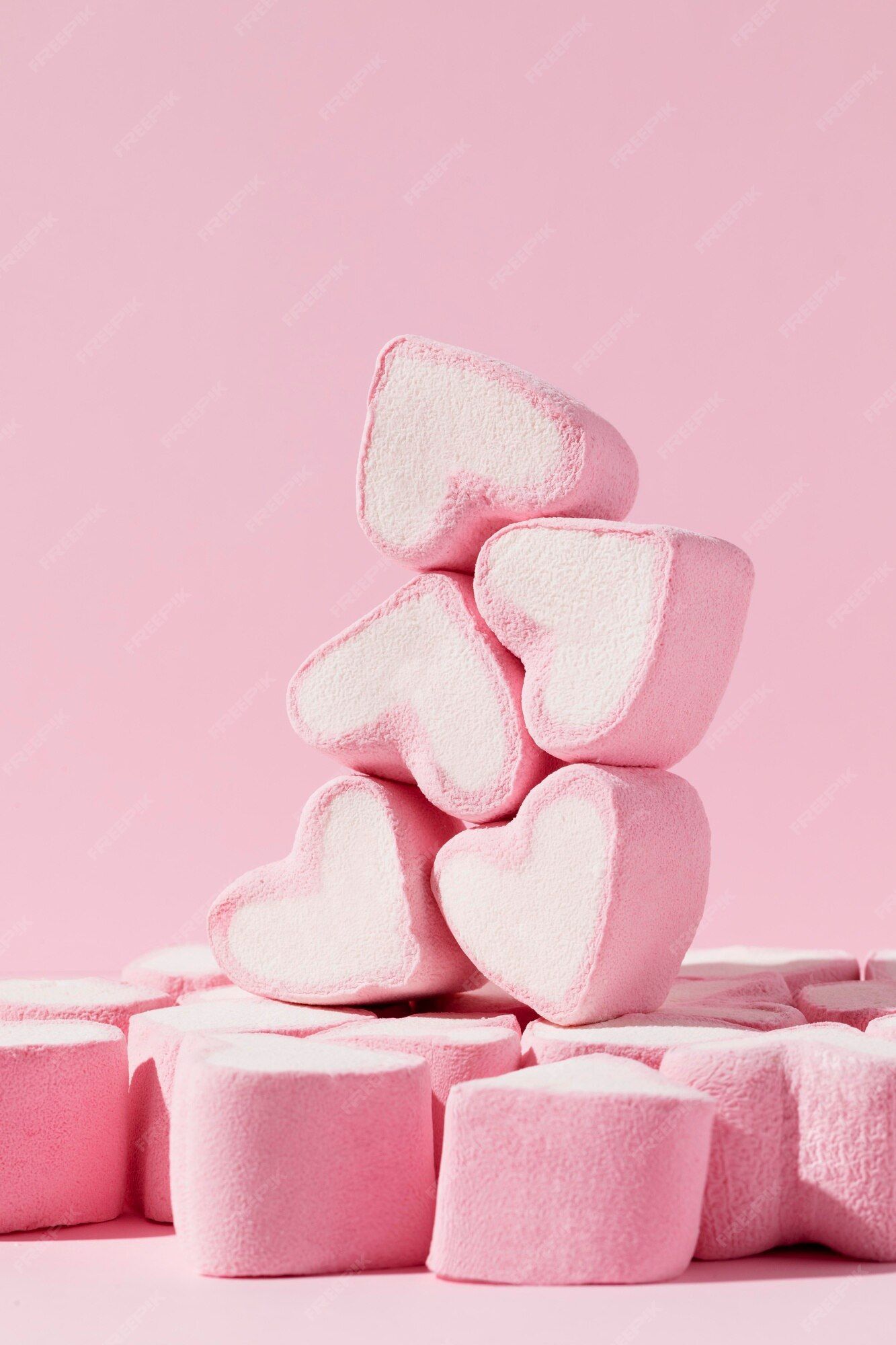 A pile of pink heart shaped marshmallows - Marshmallows