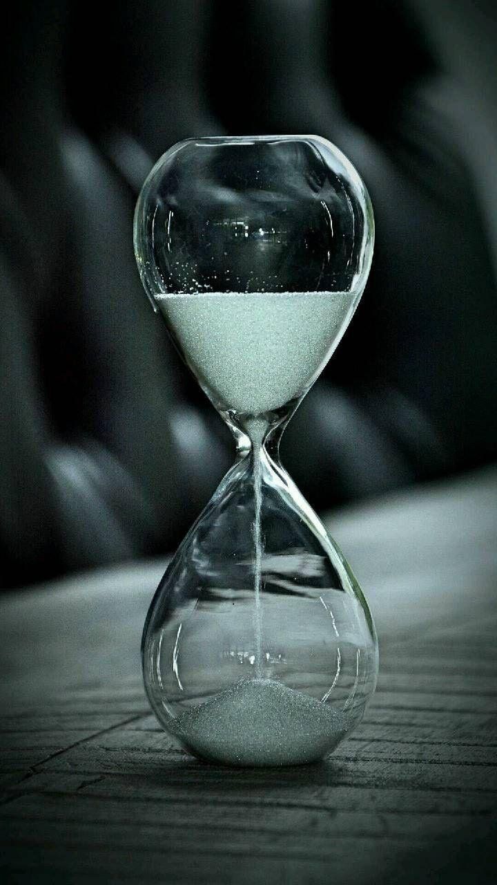 An hourglass with sand running down. - Balance