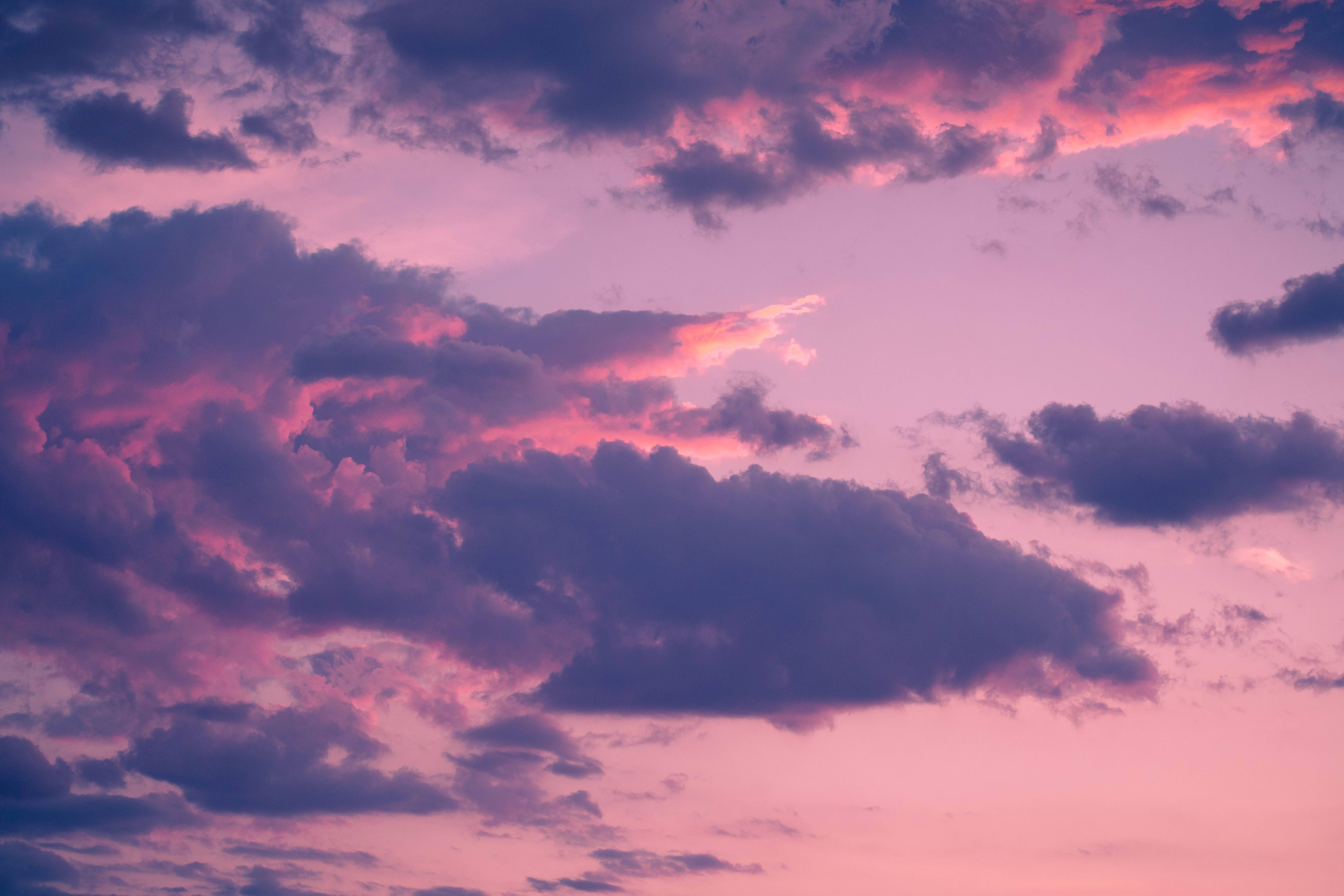 The sky during sunset with clouds of different shapes and colors. - Cloud