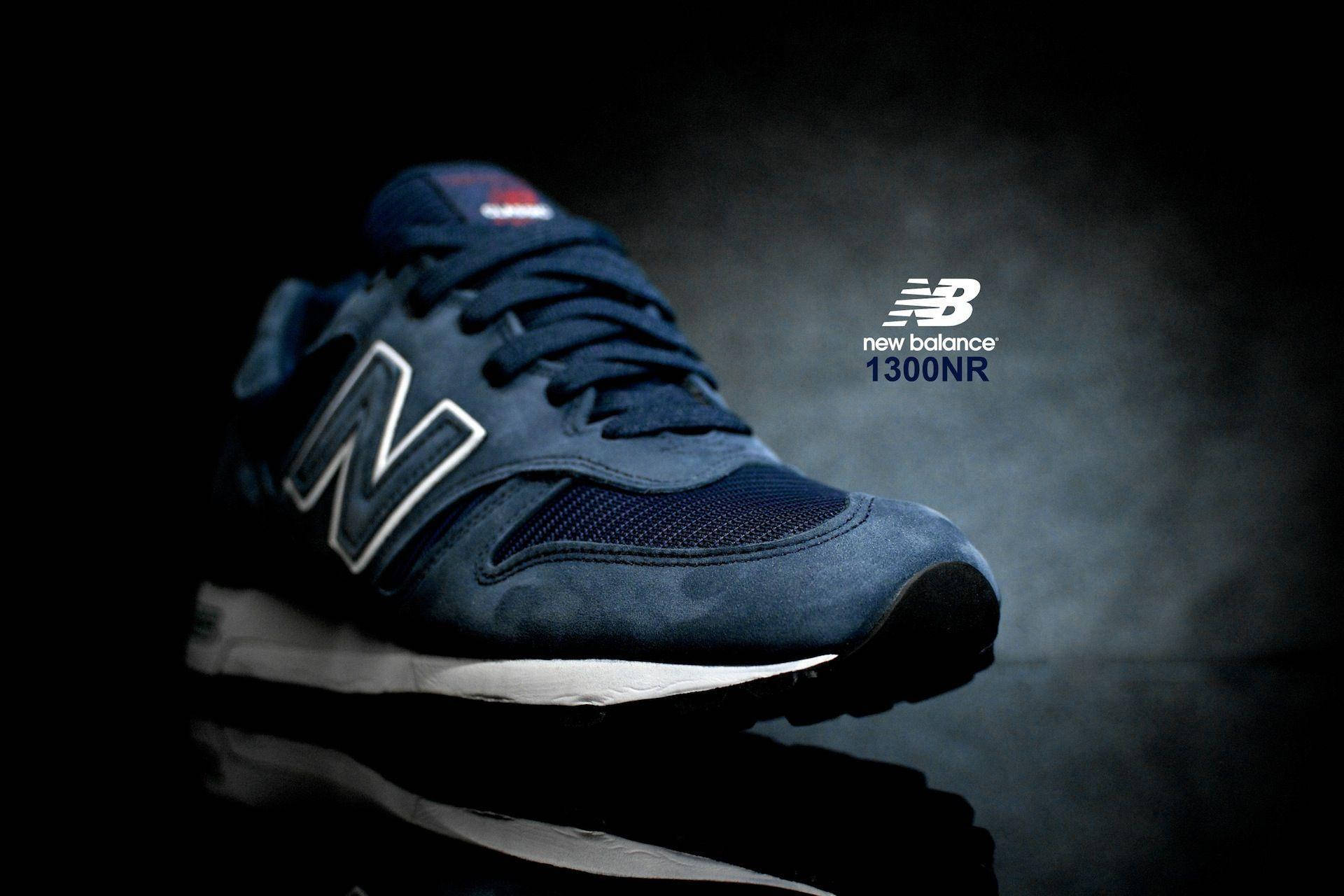 A close up of a pair of new balance 1300 in blue - New Balance