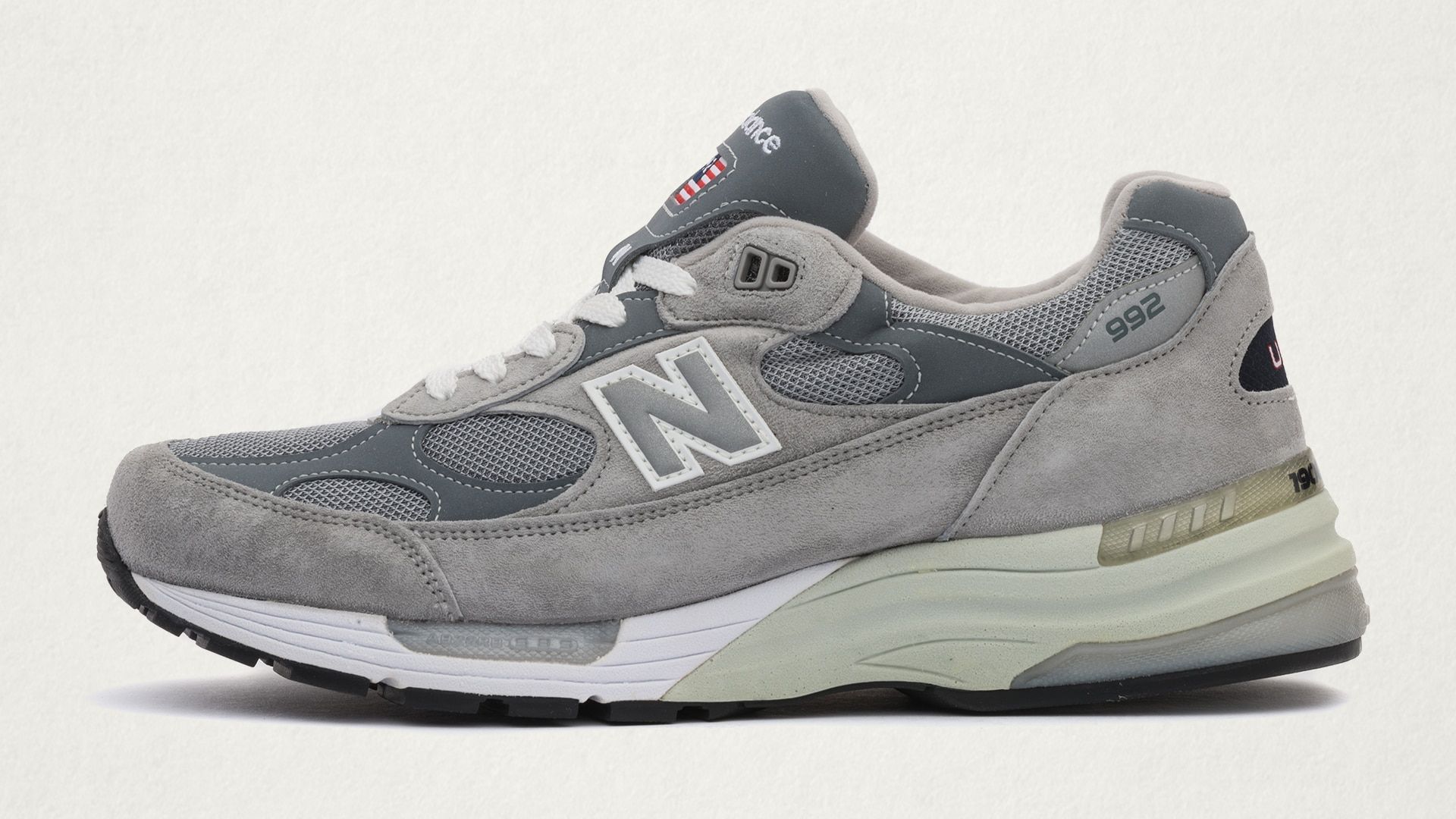 A grey New Balance 992 sneaker on a white background - New Balance