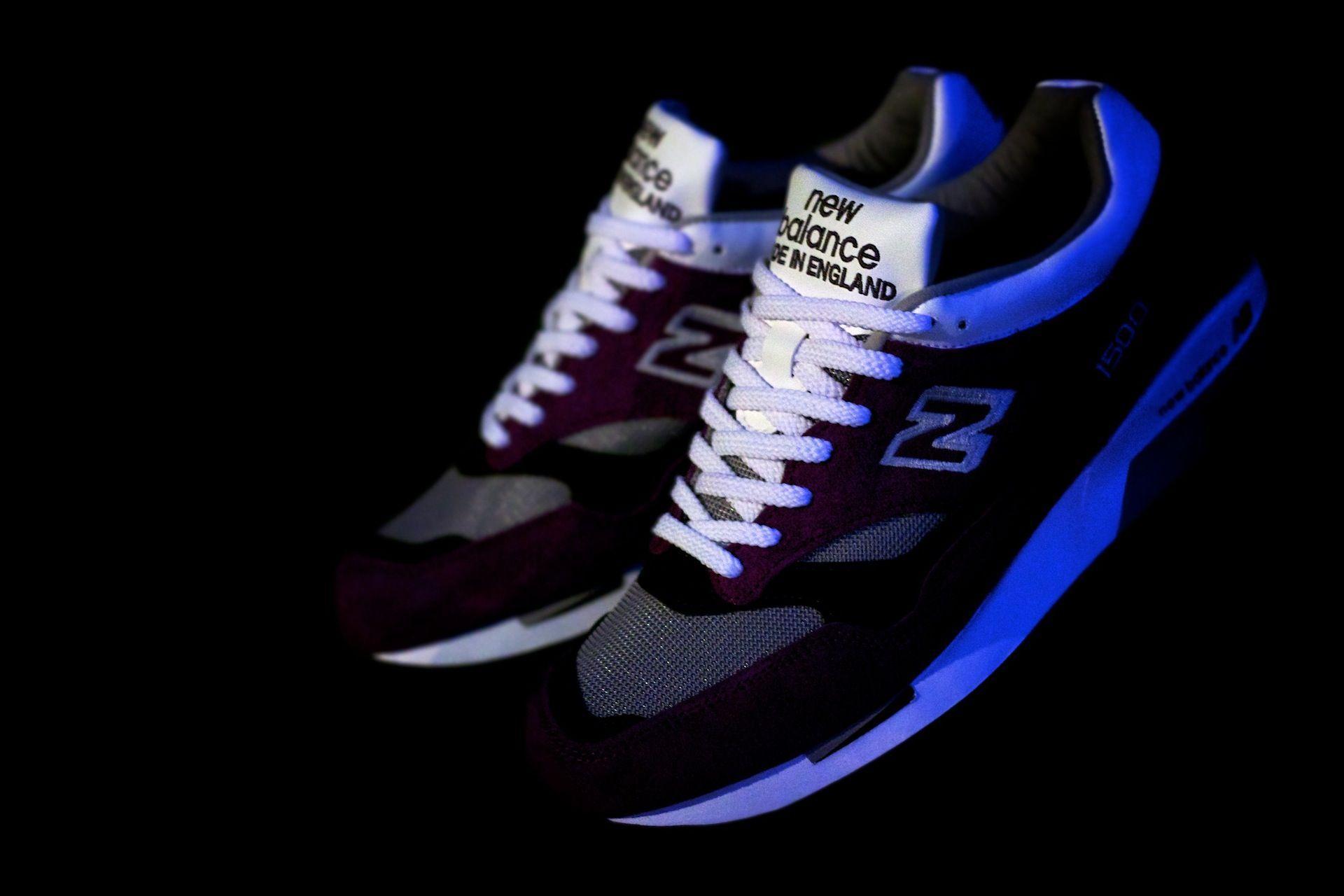 A pair of new balance sneakers in the dark. - New Balance