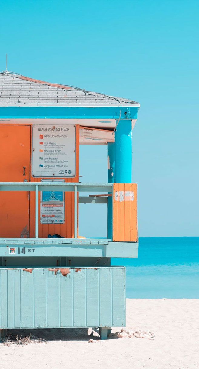Blue sky + orange beach hut & white sand iPhone wallpaper