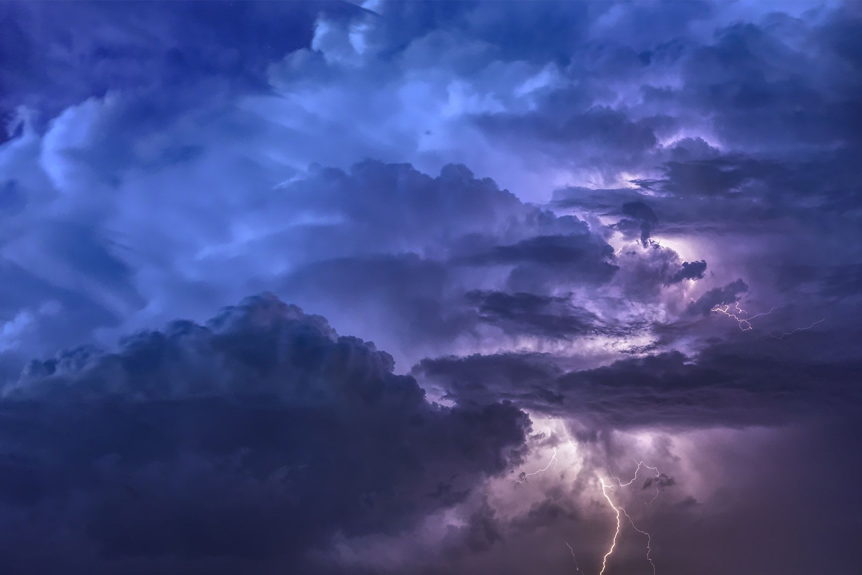 A lightning bolt strikes the sky during an intense storm - Cloud