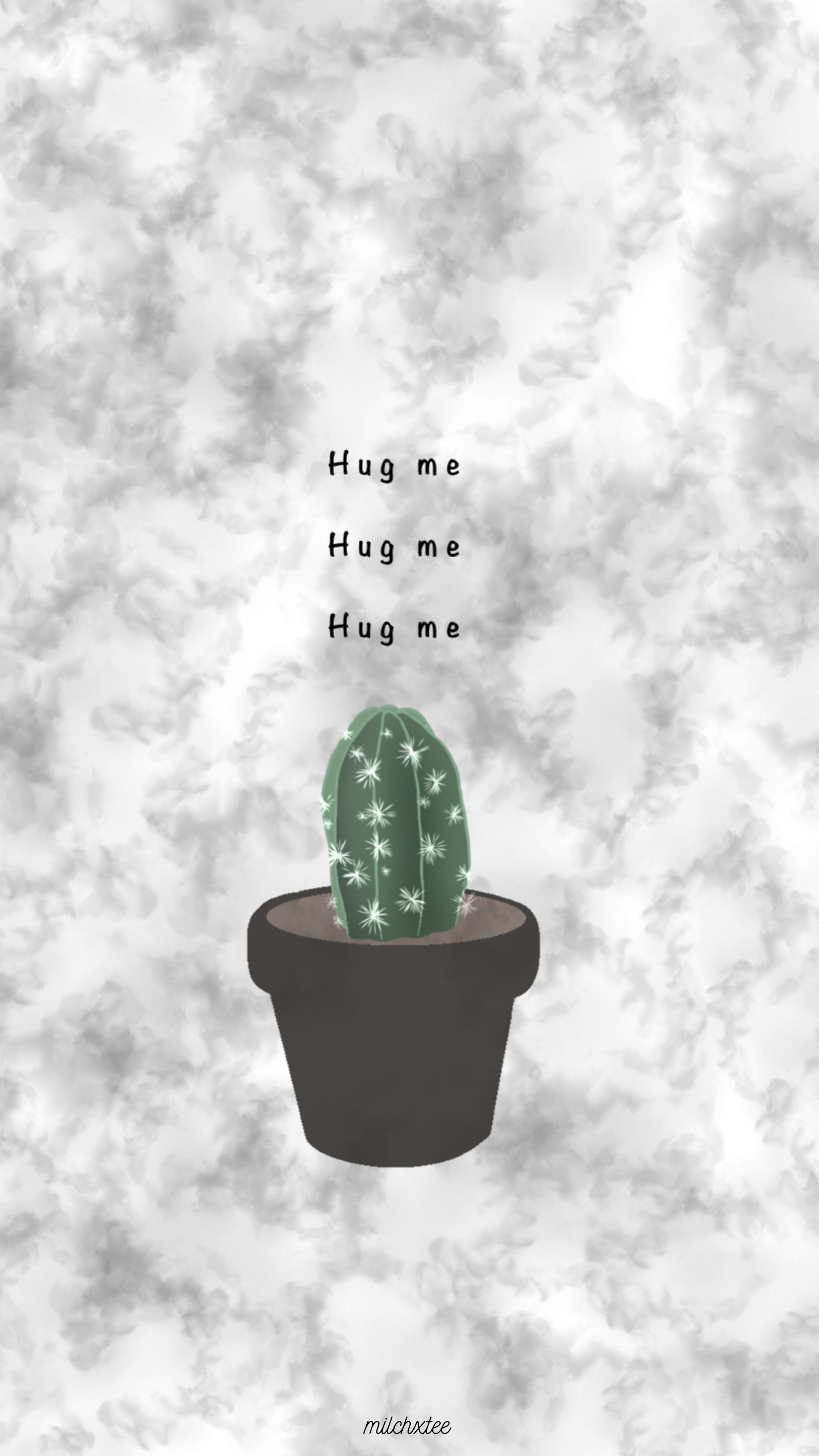 A cactus in the ground with text that says hug me - Cactus