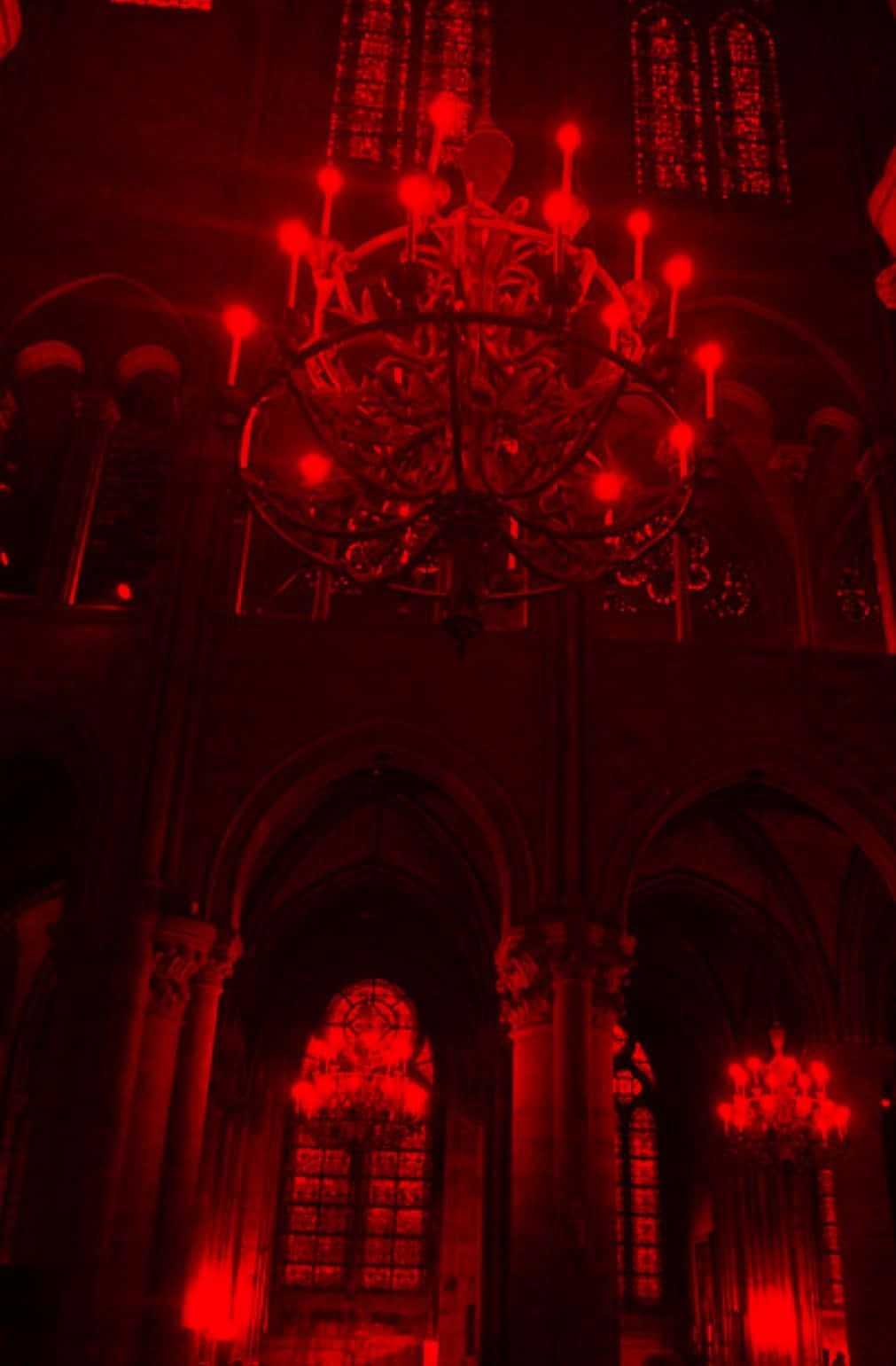 Red light illuminates the inside of Notre Dame Cathedral. - Vampire