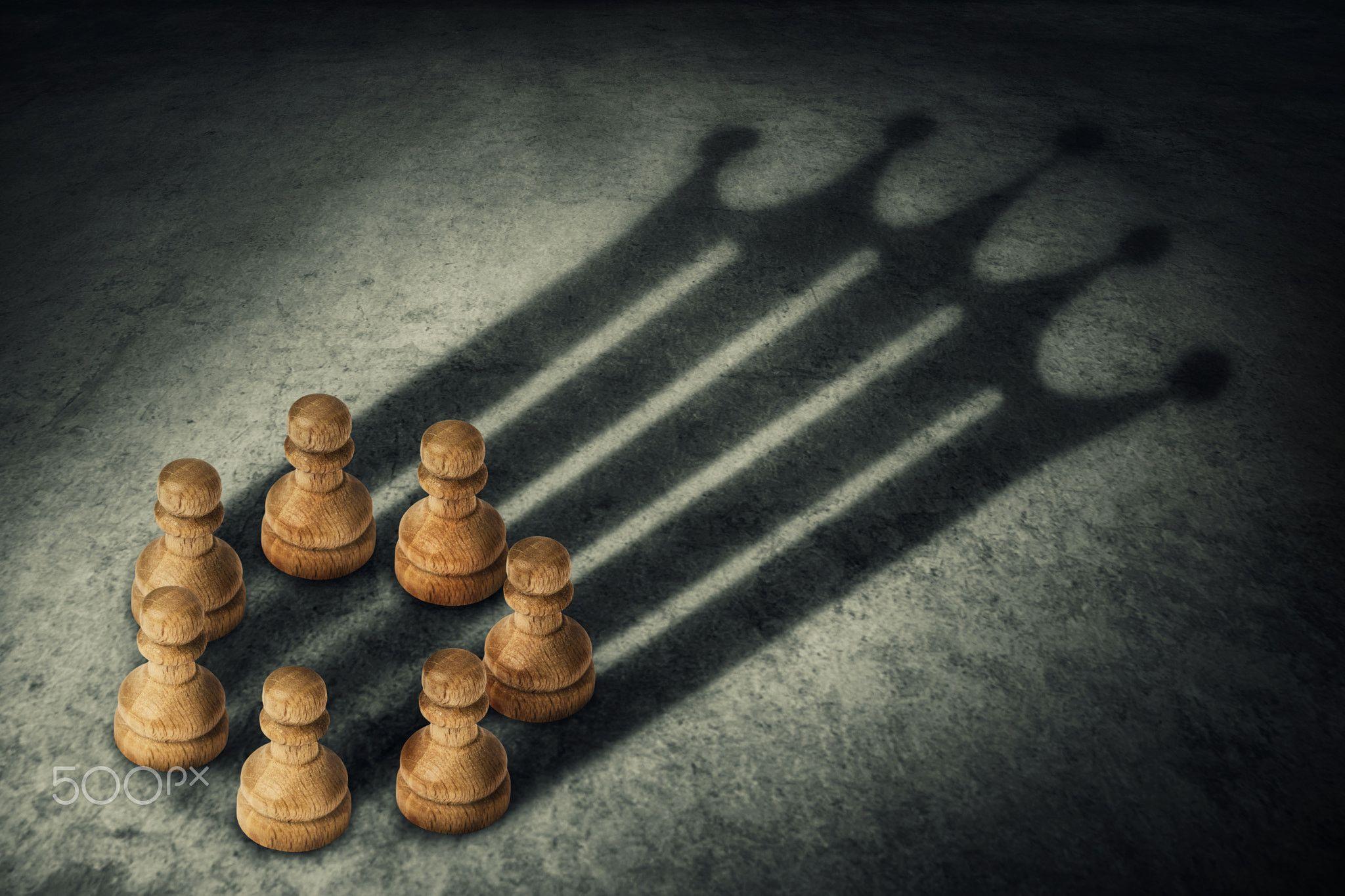 Chess pieces with a shadow of a crown - Chess