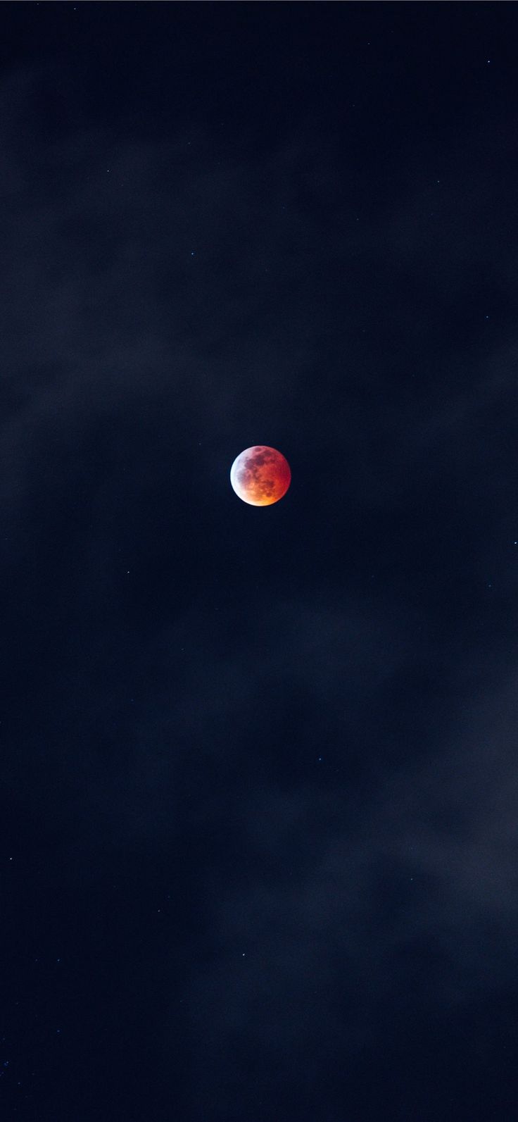 IPhone wallpaper of a red moon in the night sky. - Eclipse