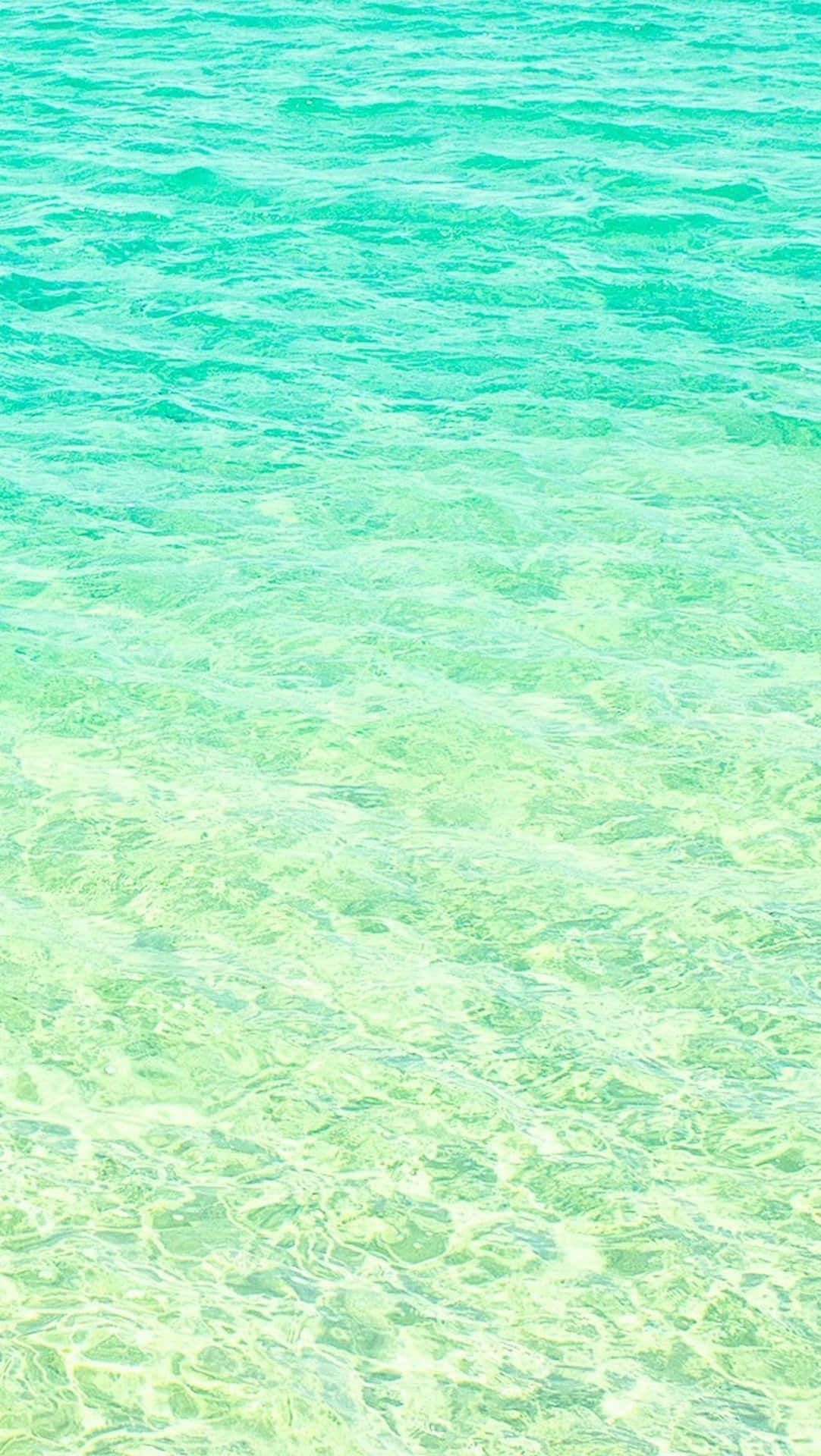 IPhone wallpaper of a beautiful turquoise sea with waves - Aqua