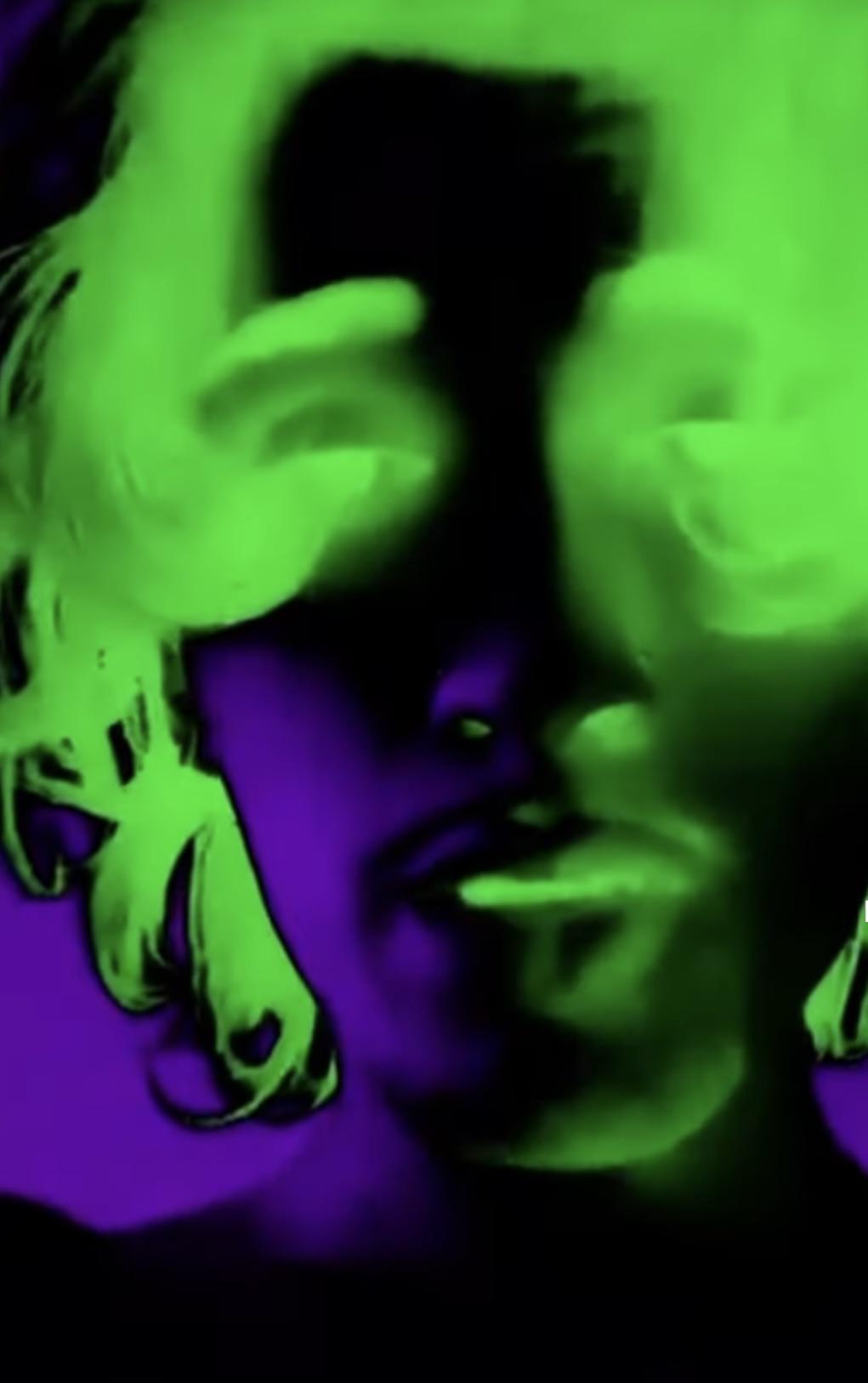 A man's face is shown in a purple and green hue. - Lime green, neon green