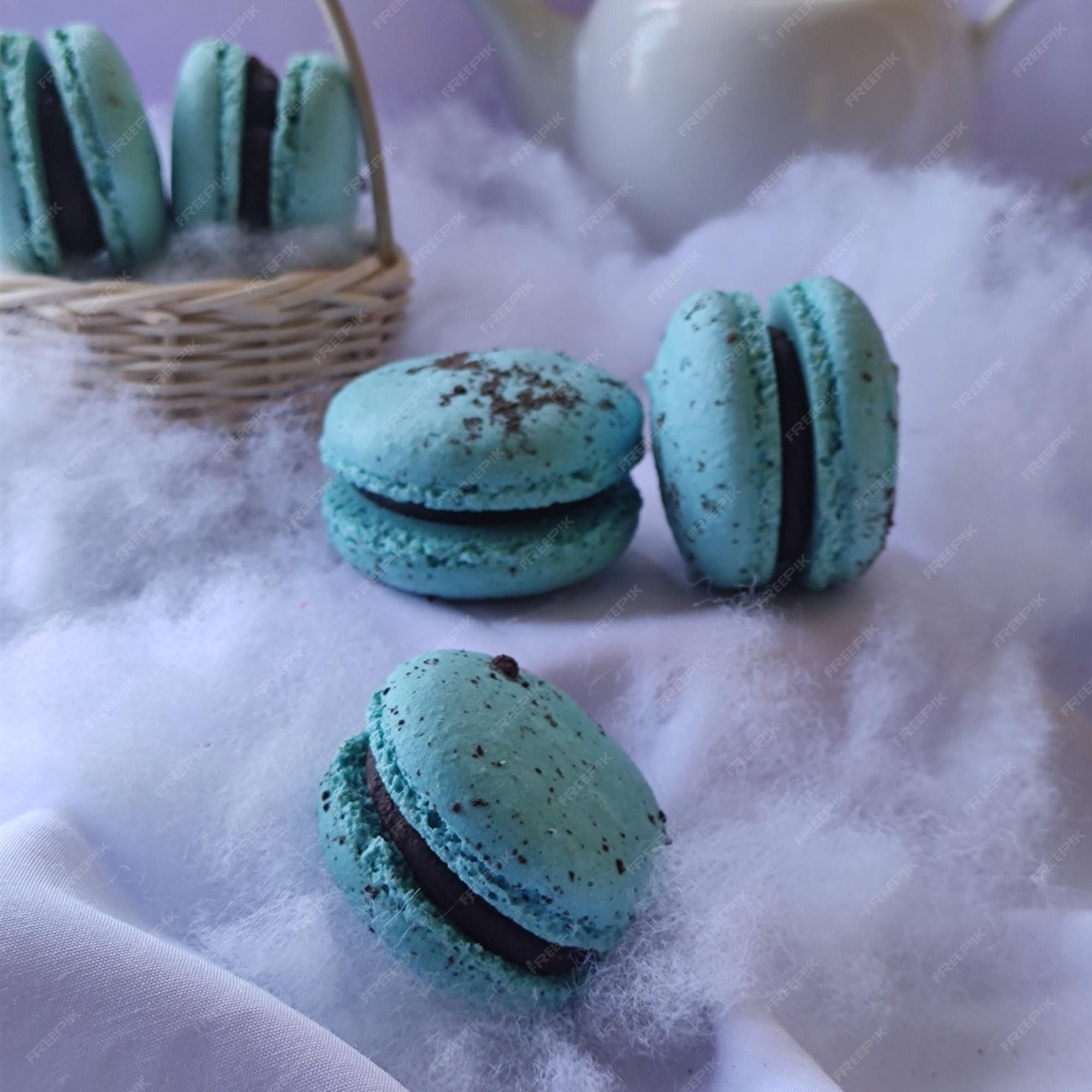 A blue macaron against a white background - Macarons