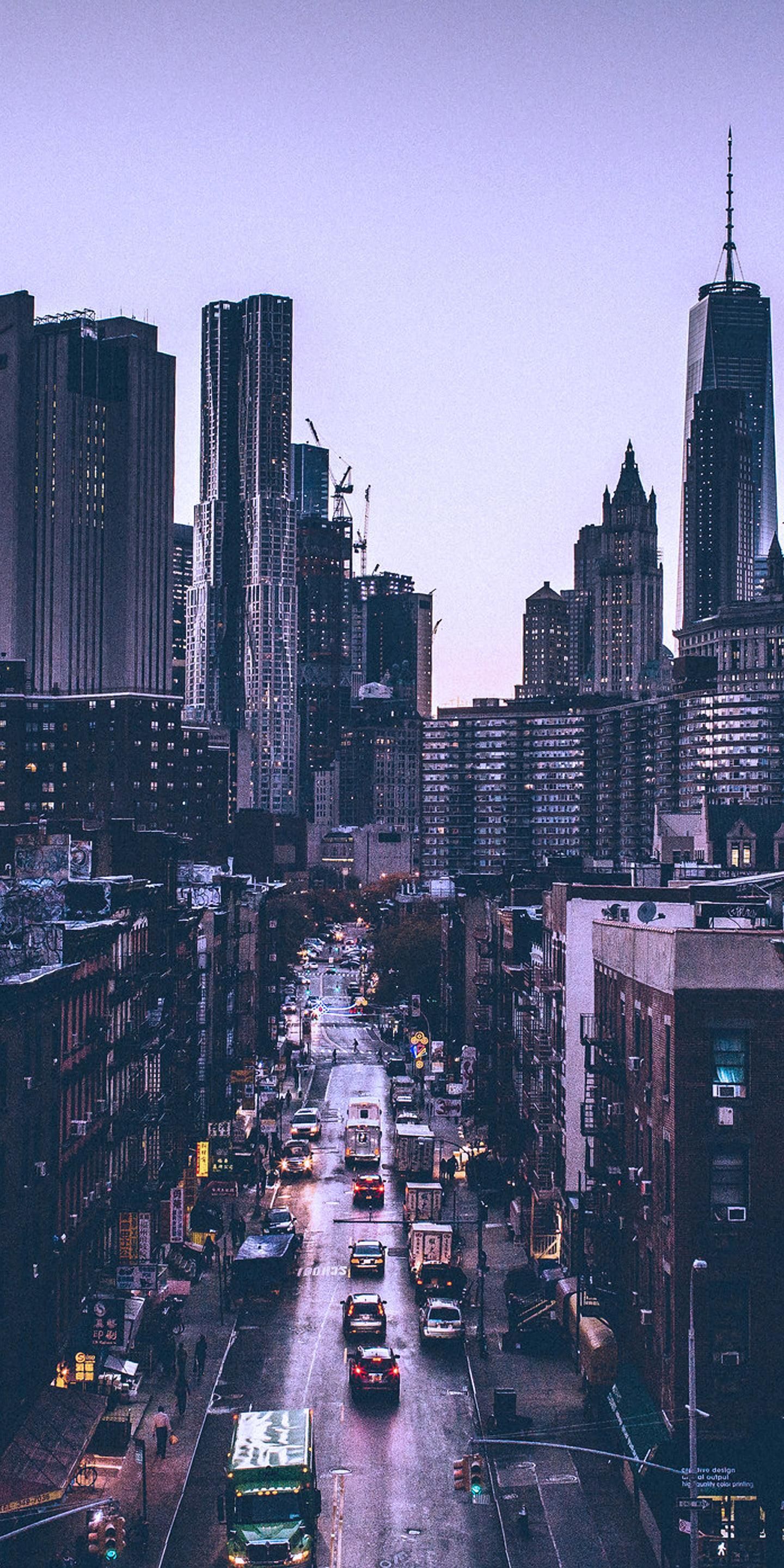 A city street with tall buildings and traffic - New York, city