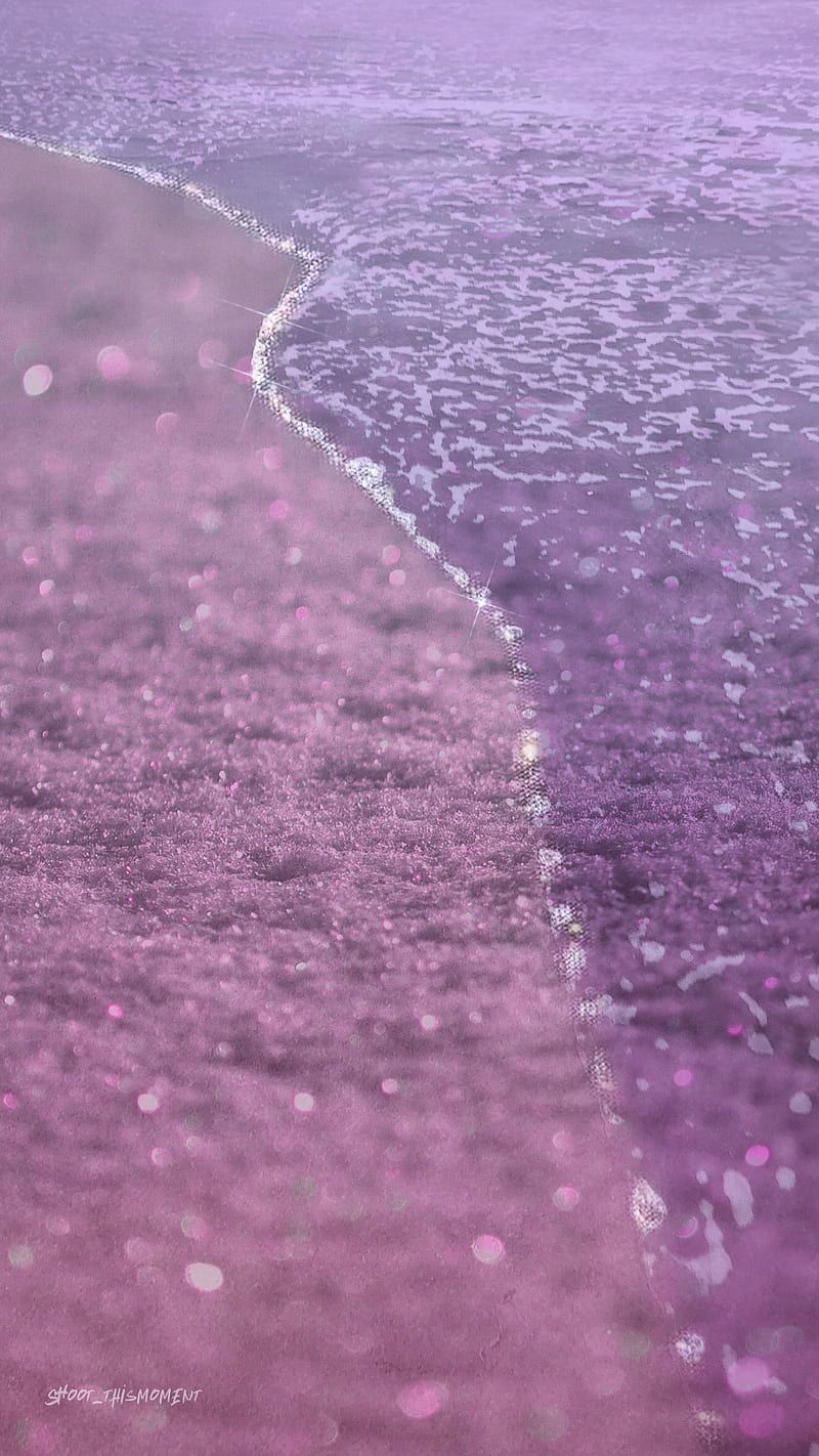 Sparkling purple water at the beach - Sand