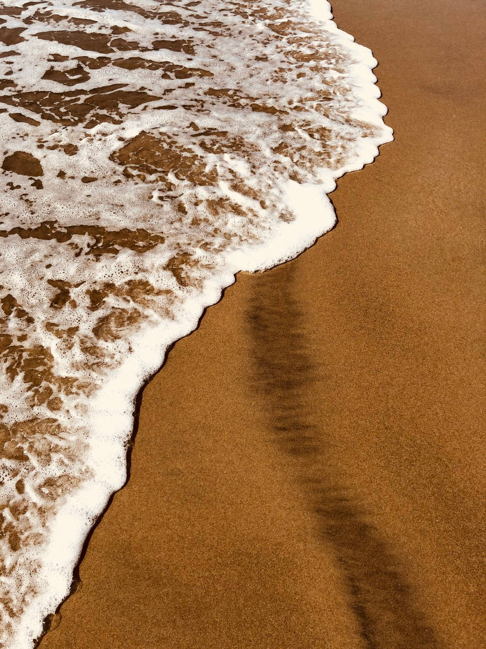 The image may possible be related to Download Light Brown Aesthetic Seashore Wallpaper - Sand