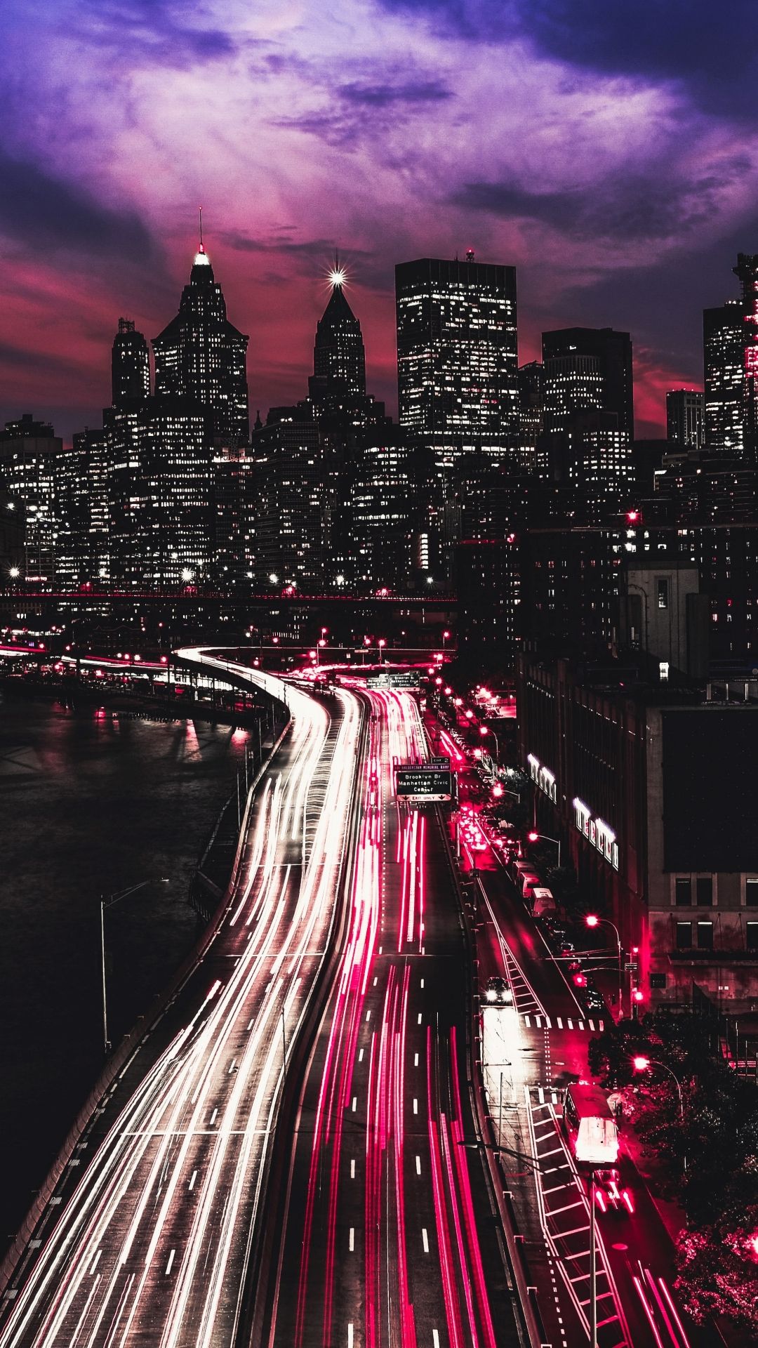 A city at night with a purple sky - New York