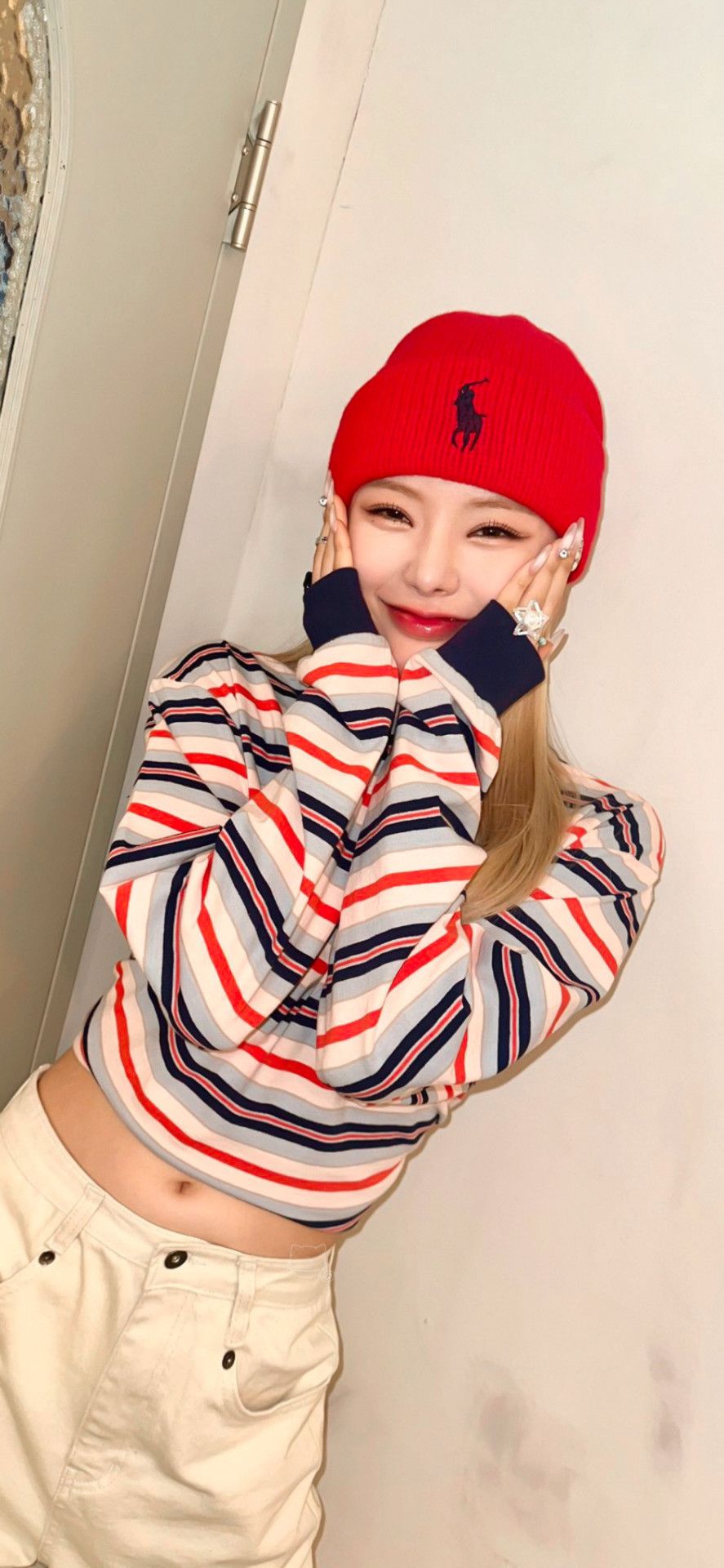 Lisa (BLACKPINK) in a red beanie and a striped shirt - FIFTY FIFTY