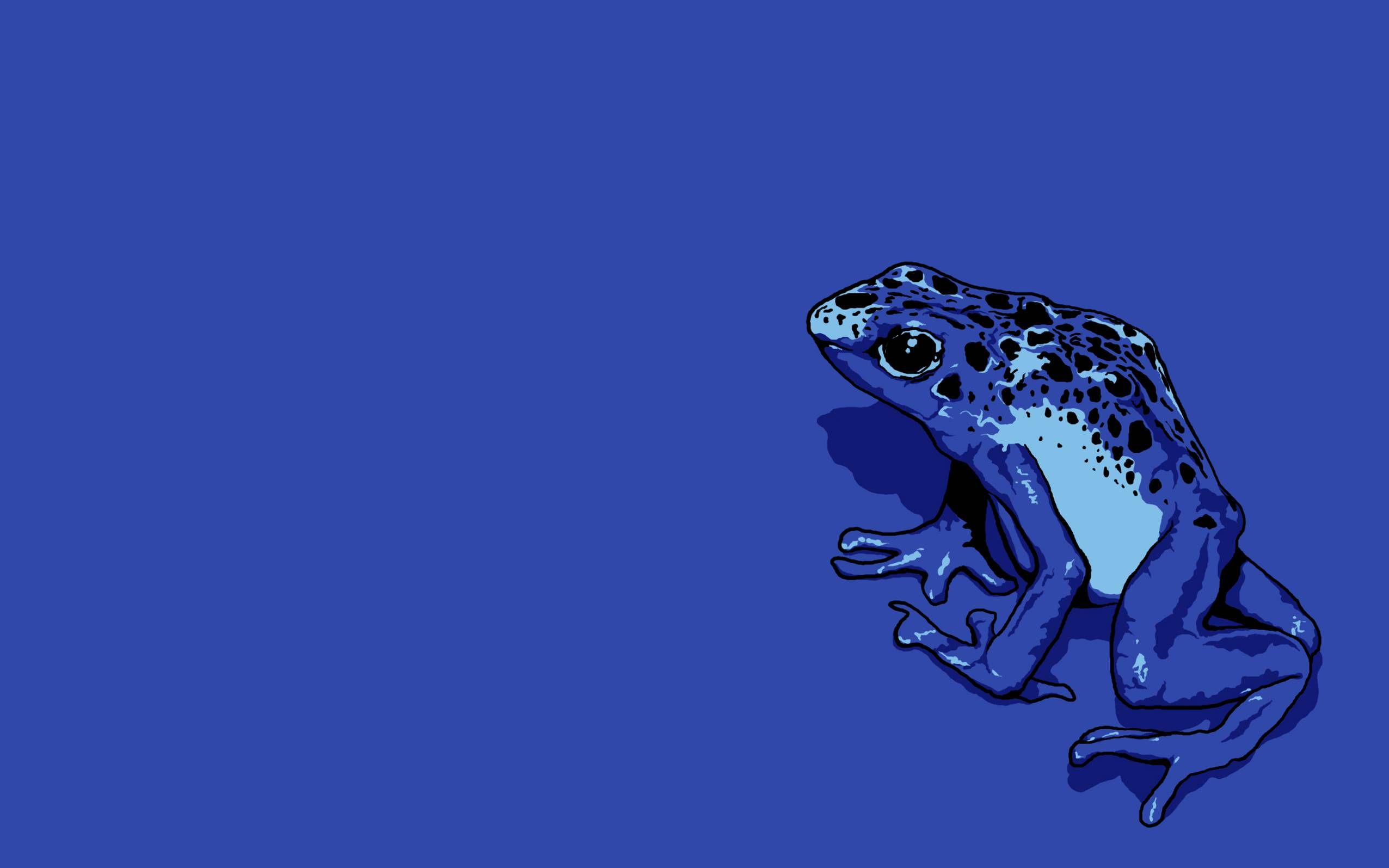 A blue frog sitting on the ground with black spots - Frog