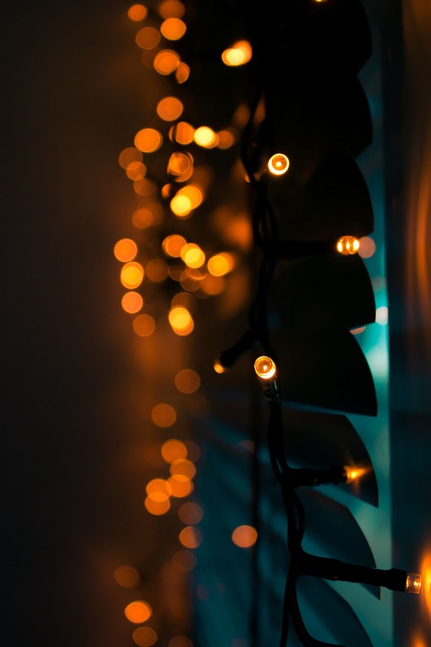 String lights on a wall in a dark room - Fairy lights