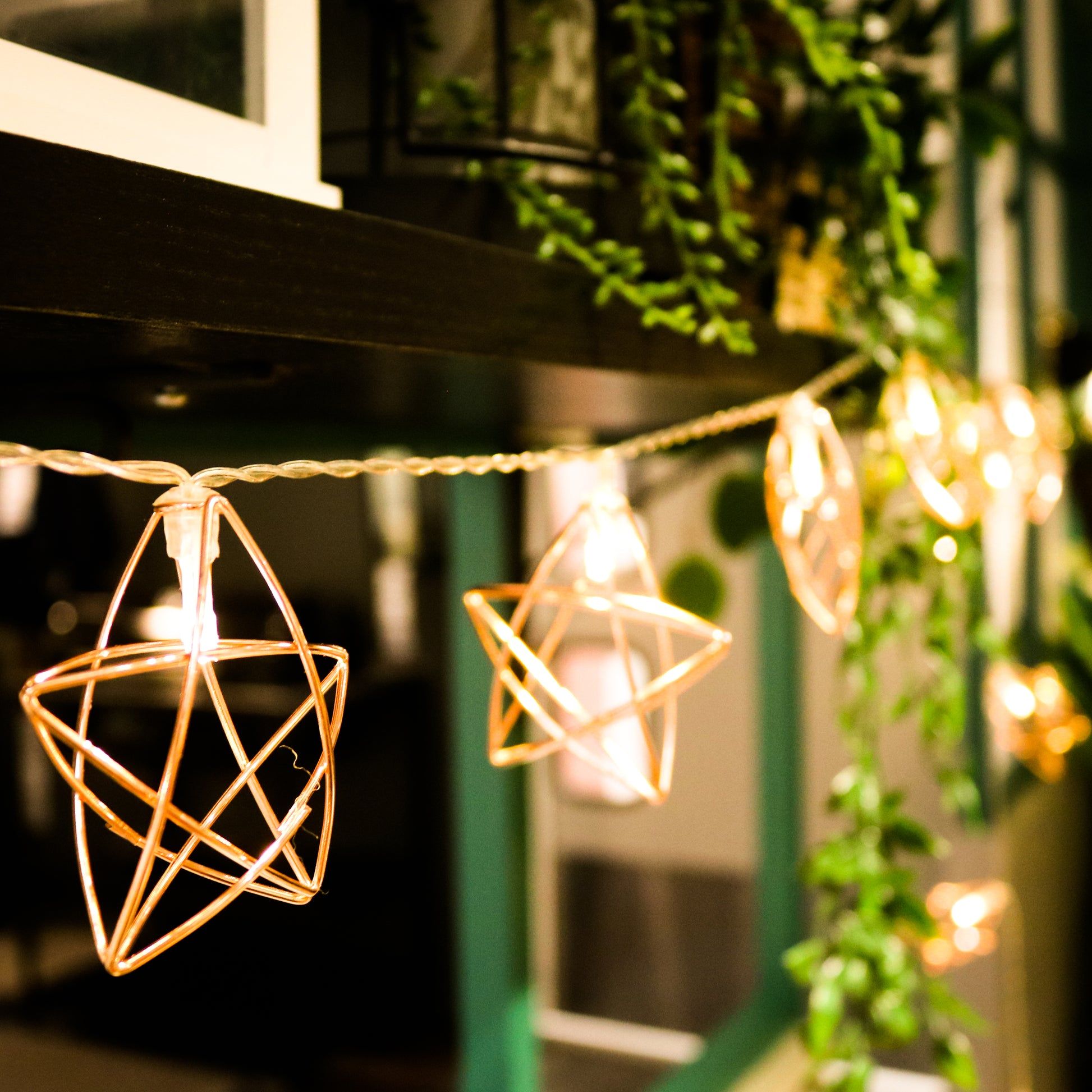 String lights with star-shaped bulbs hanging from a porch - Fairy lights