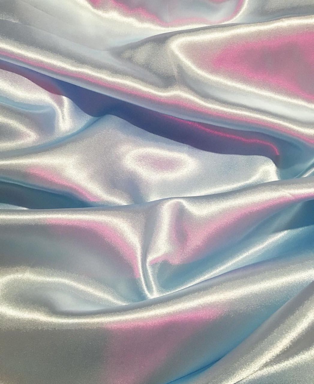 A close up of a silver and pink iridescent fabric - Silk, iridescent