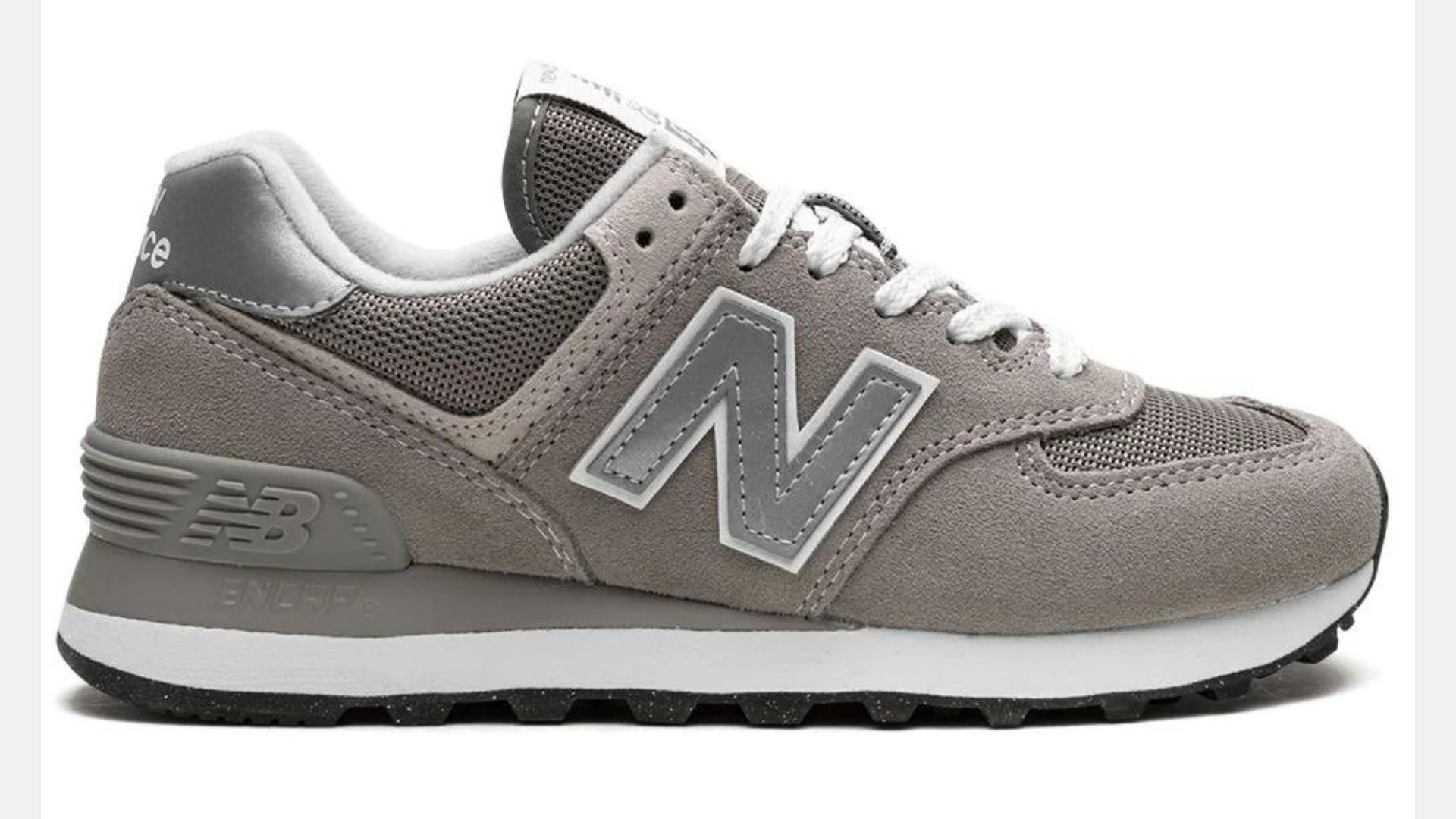 A pair of grey New Balance sneakers with a white sole - New Balance