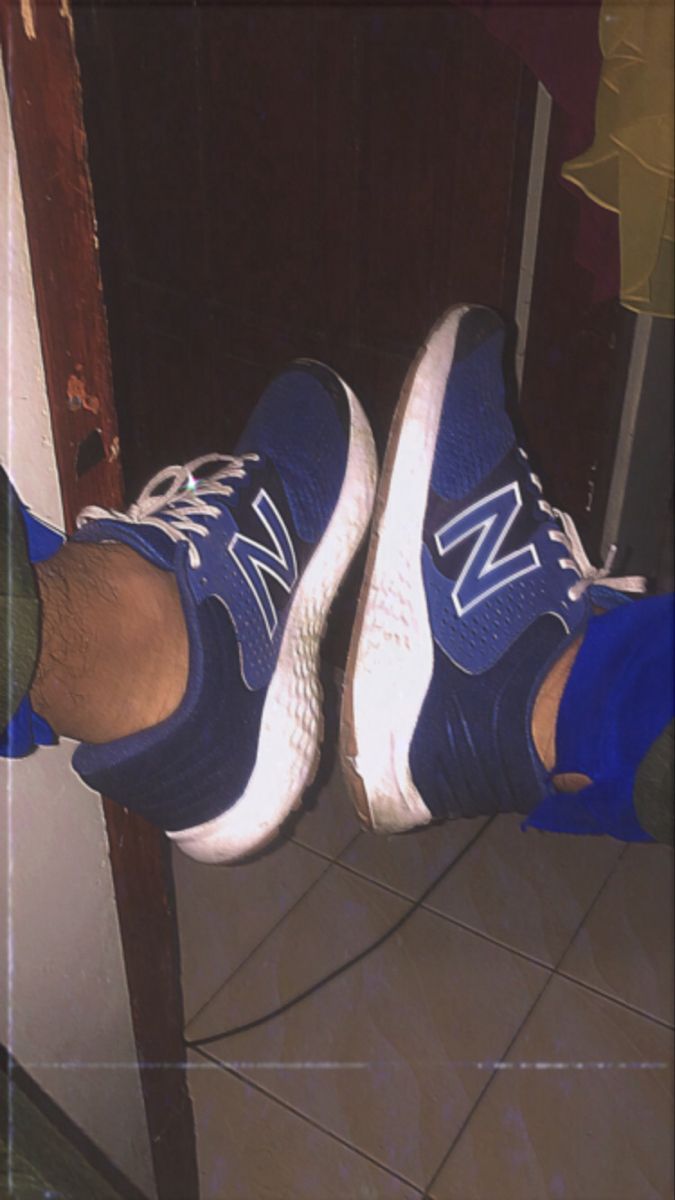 A pair of new balance shoes - New Balance