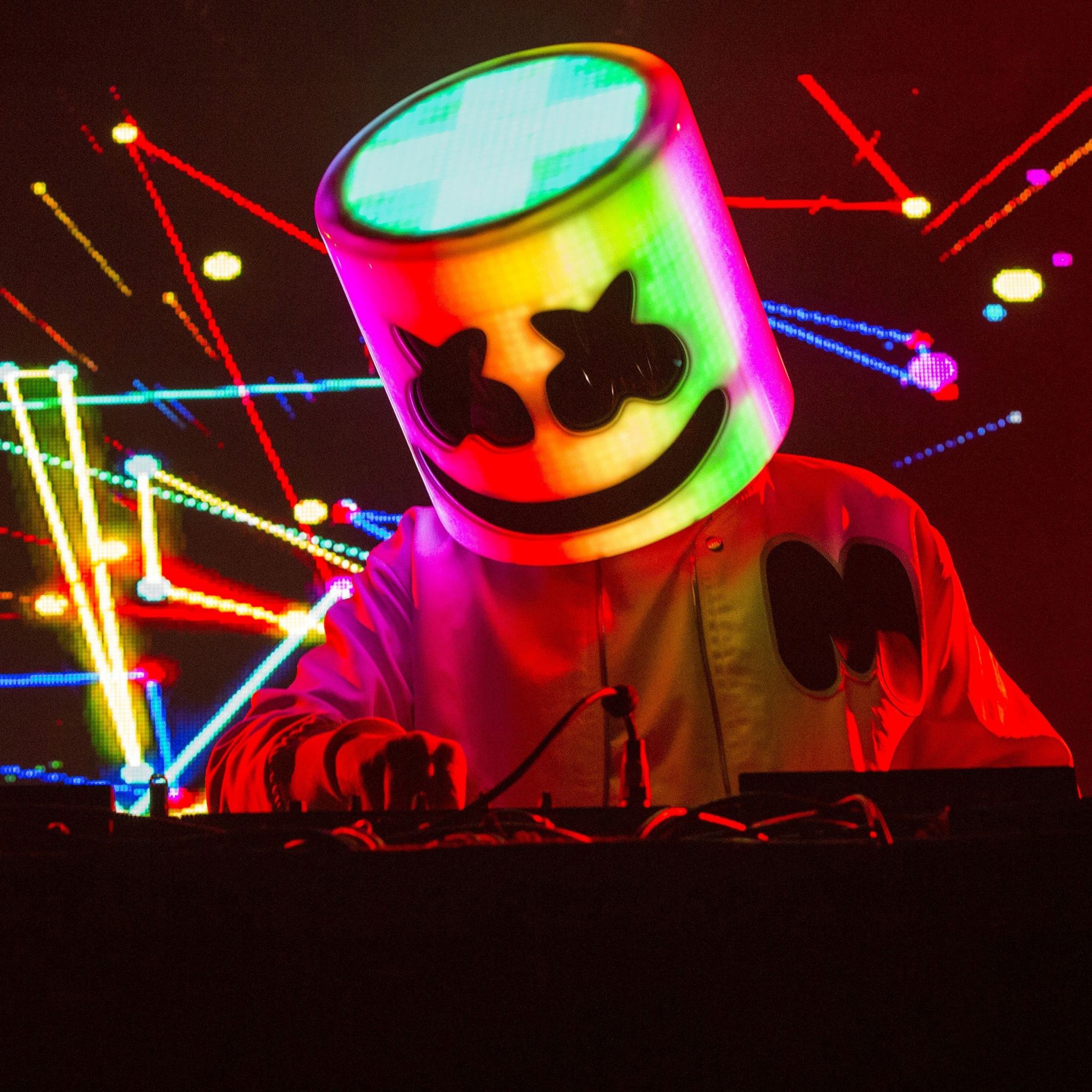 Marshmello is a popular DJ who is known for his large smiley face helmet. - Marshmello