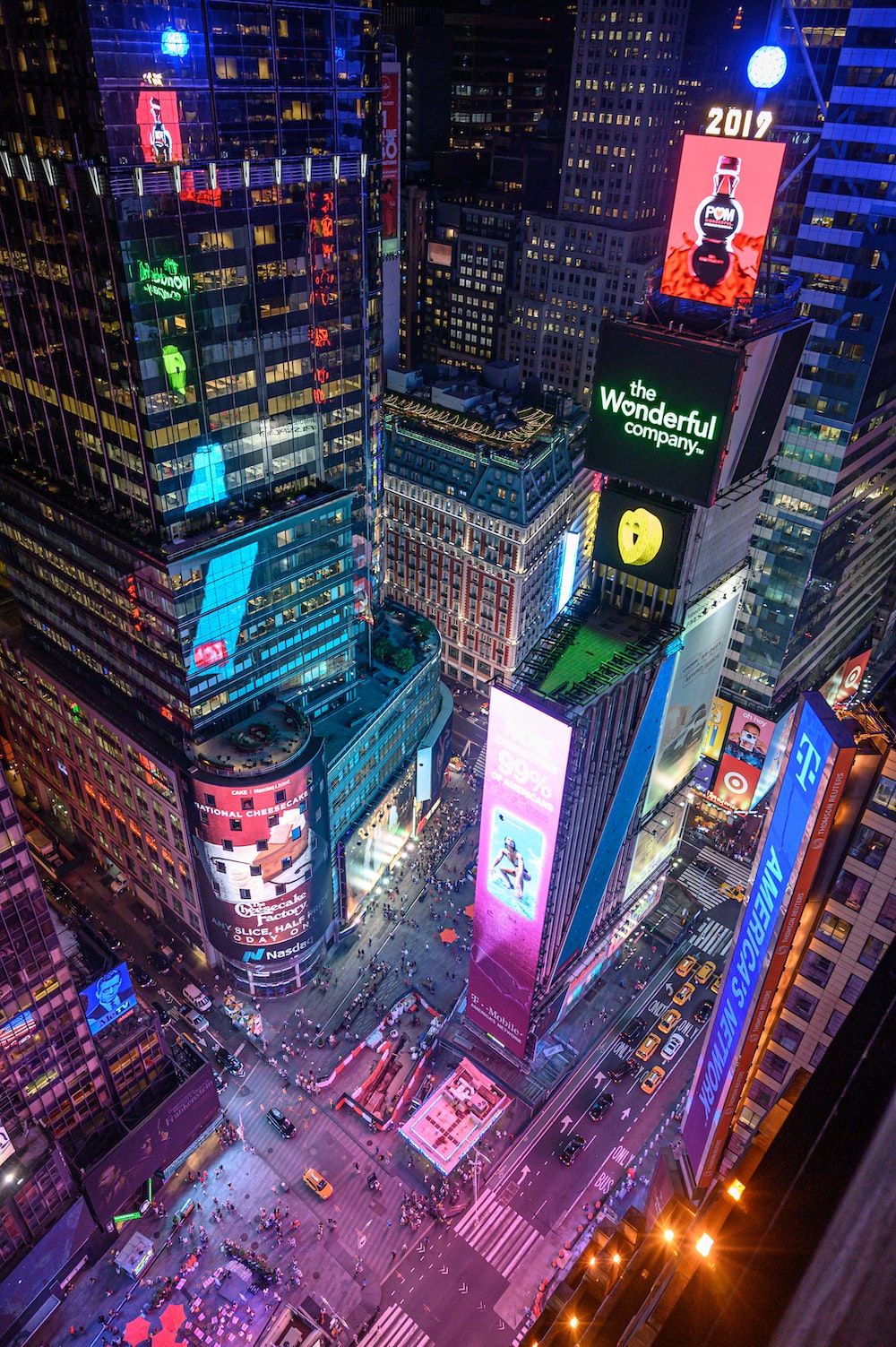 A city at night with many tall buildings - New York