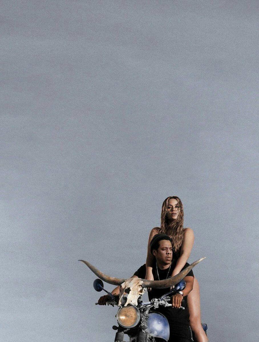 A man and woman on the back of motorcycle - Beyonce