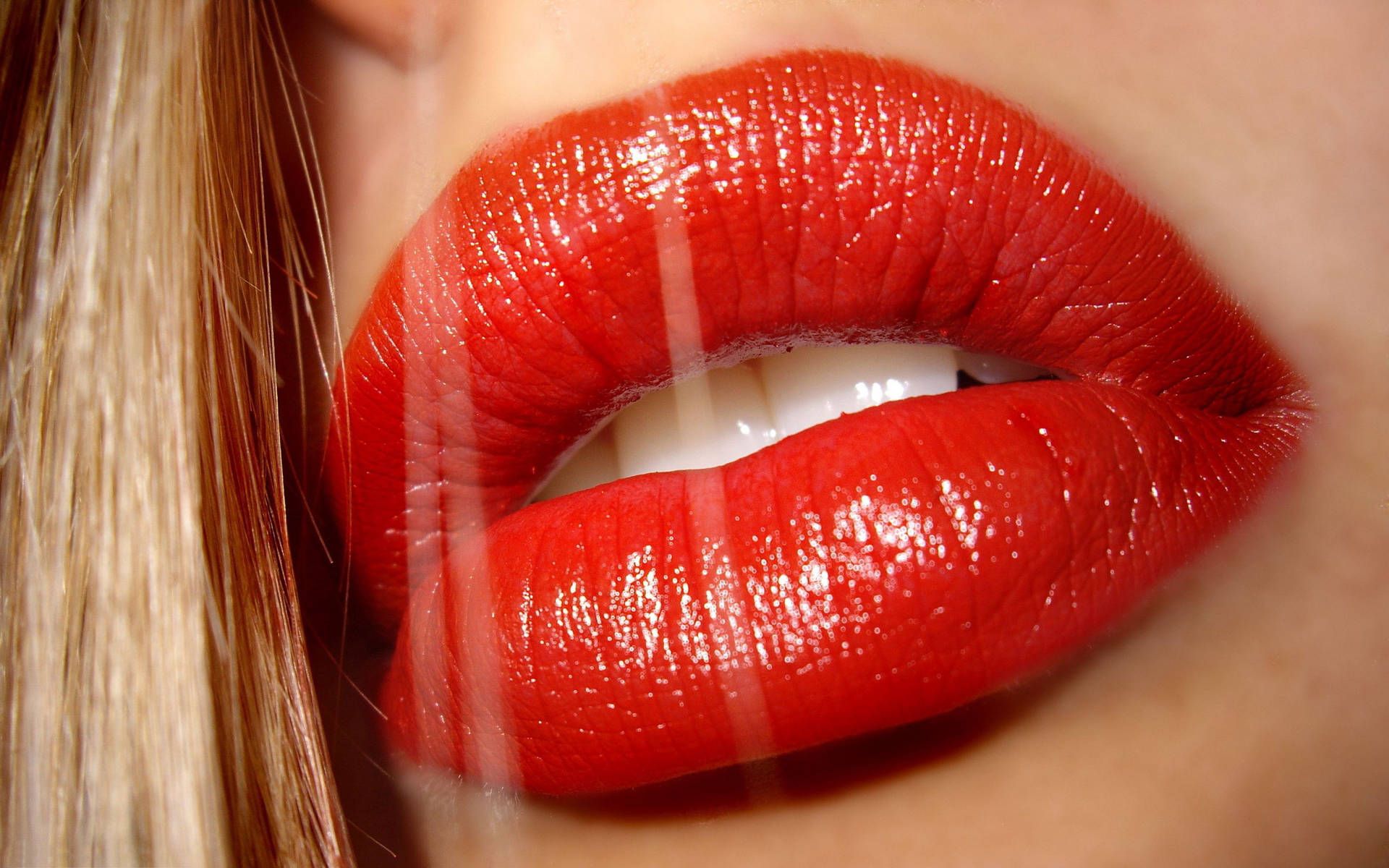 Close up of a woman's lips with red lipstick - Lips
