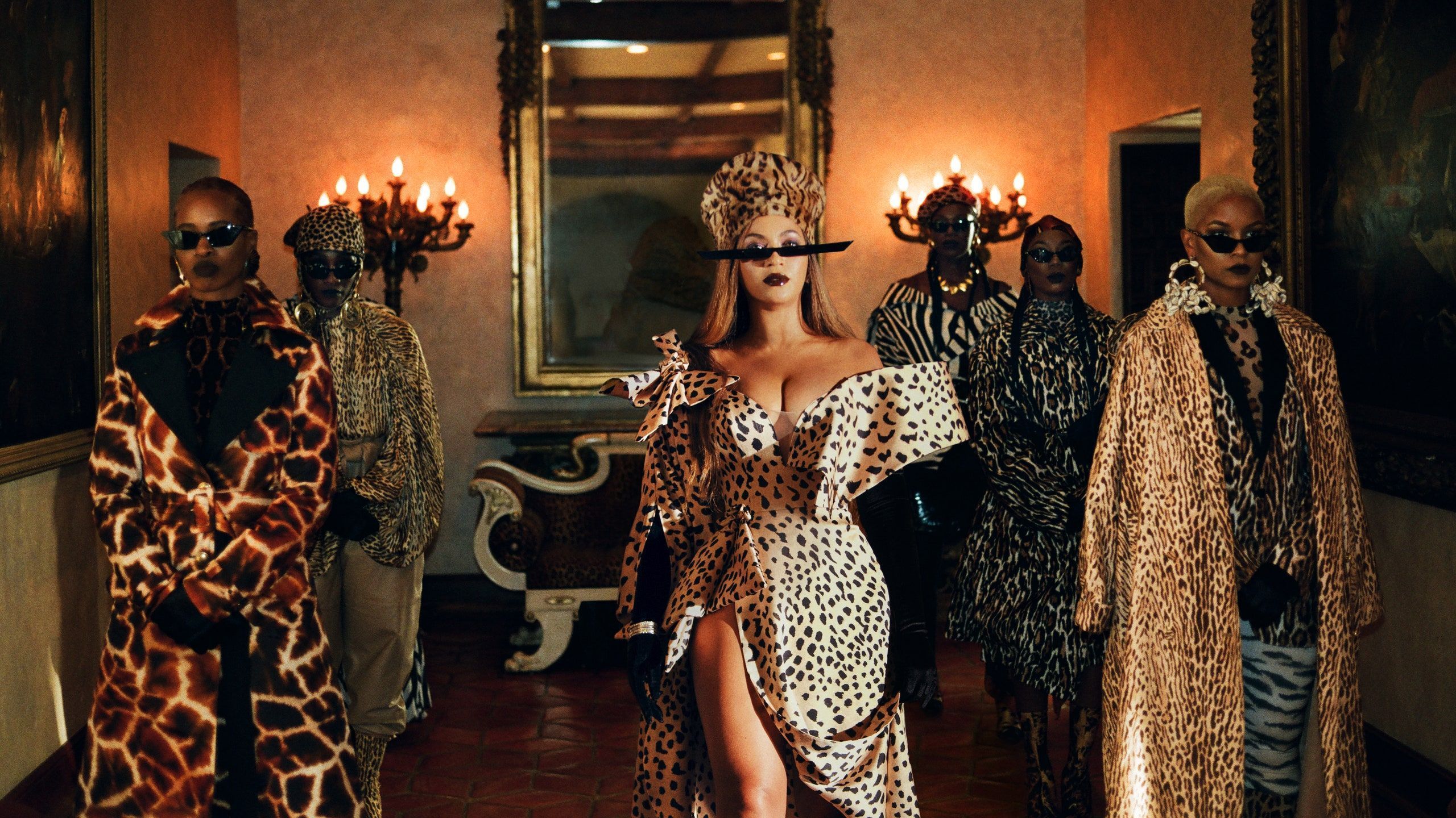 A group of people in leopard print clothing - Beyonce