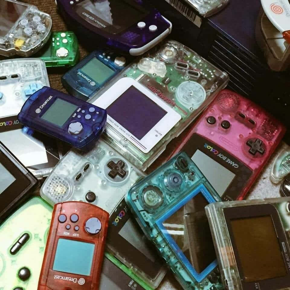 A collection of Gameboy Advance consoles and games. - Game Boy
