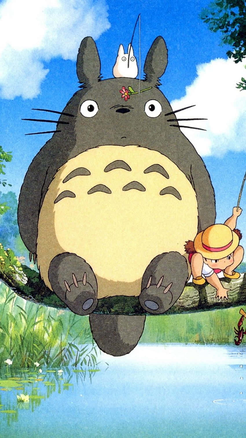 Download a totoro and a girl sitting on a branch Wallpaper