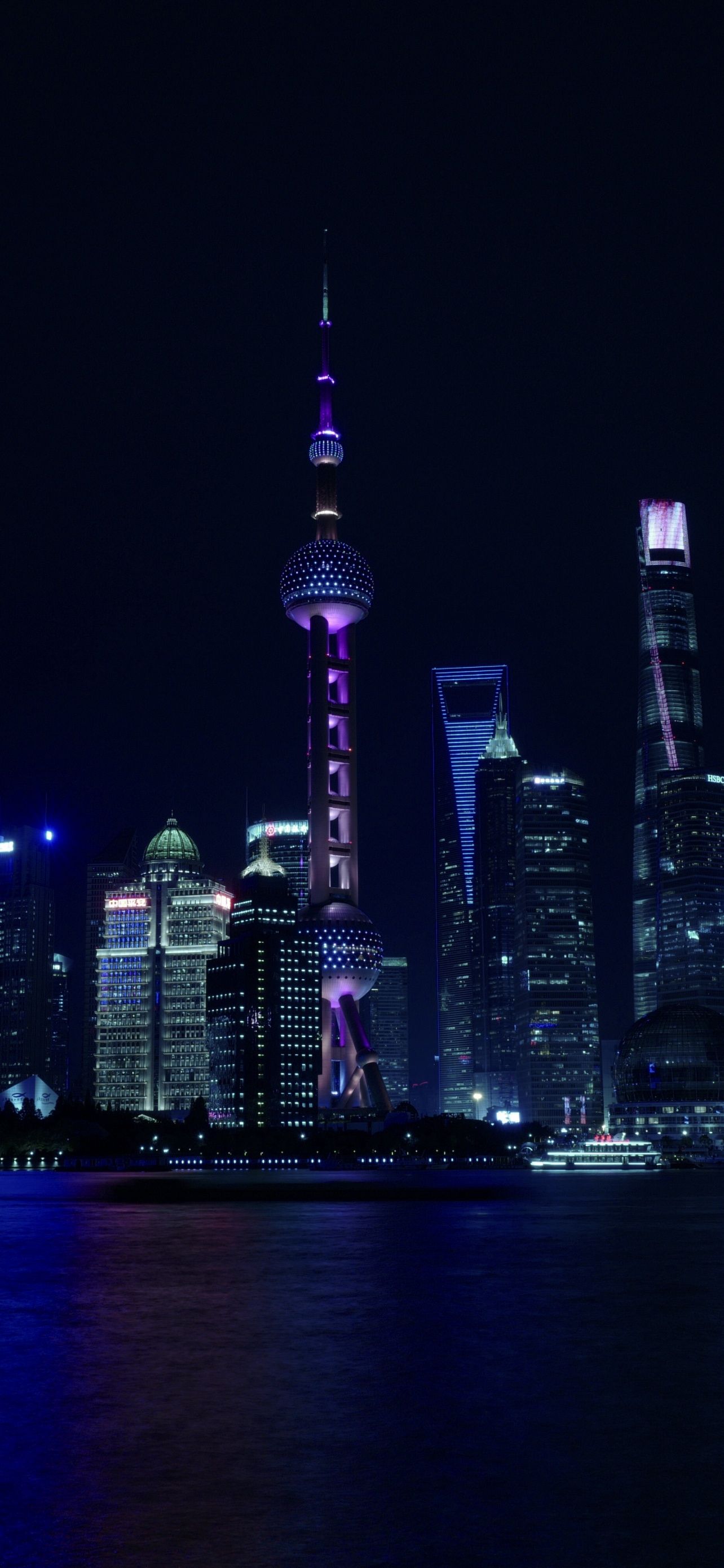 The oriental pearl tower is lit up at night in Shanghai, China. - Chinese