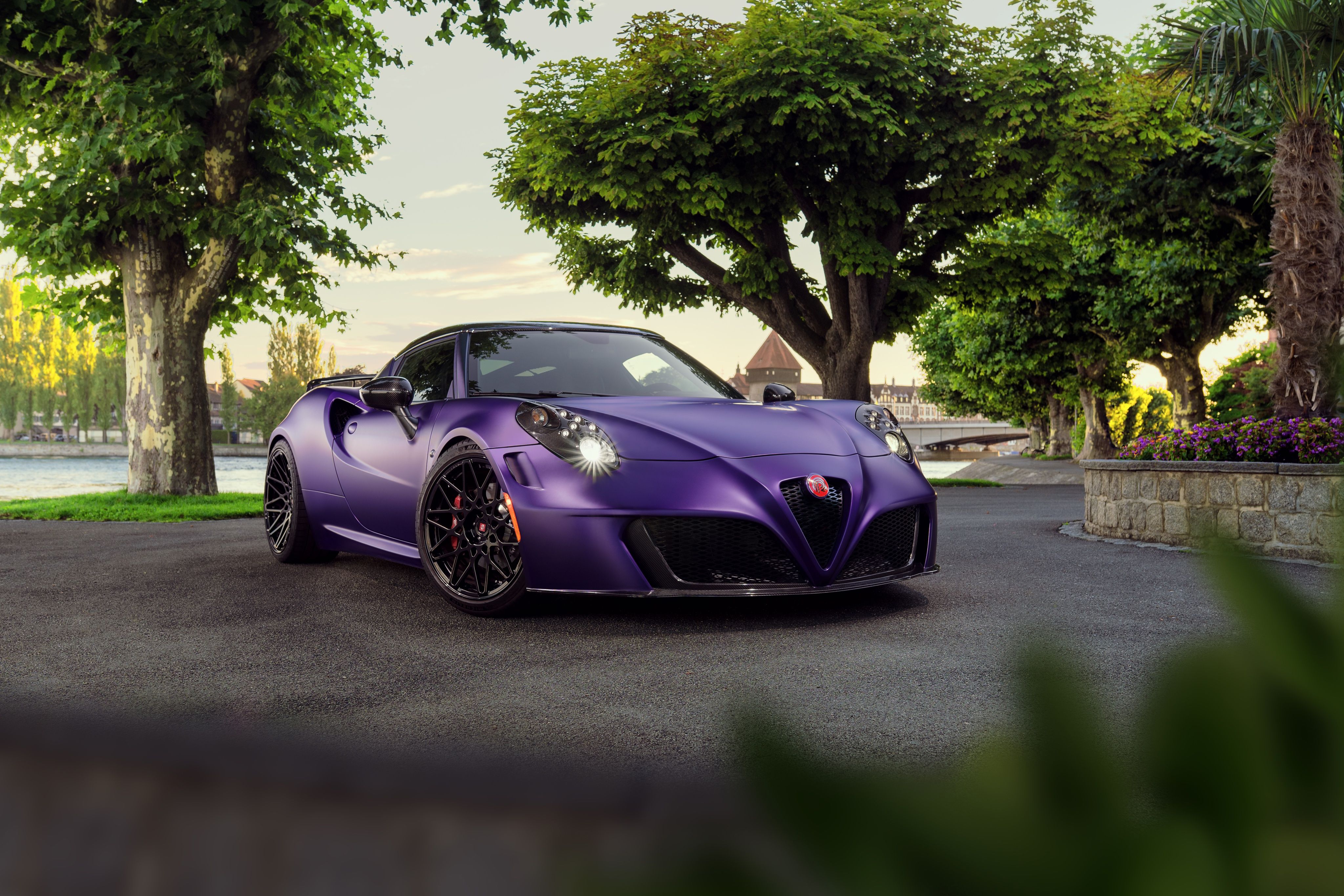 2016 Alfa Romeo 4C Spider by Novitec Rosso in purple.<ref> Front three-quarter view</ref><box>(191,351),(702,695)</box> of the car - Cars