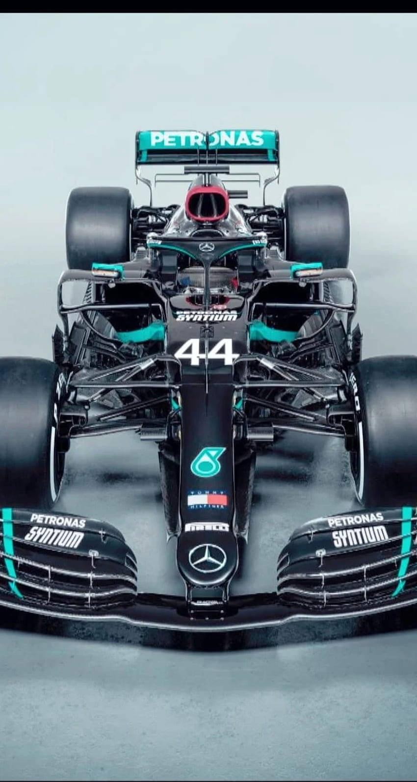 Download Lewis Hamilton F1 Sitting On His Racing Car Wallpaper